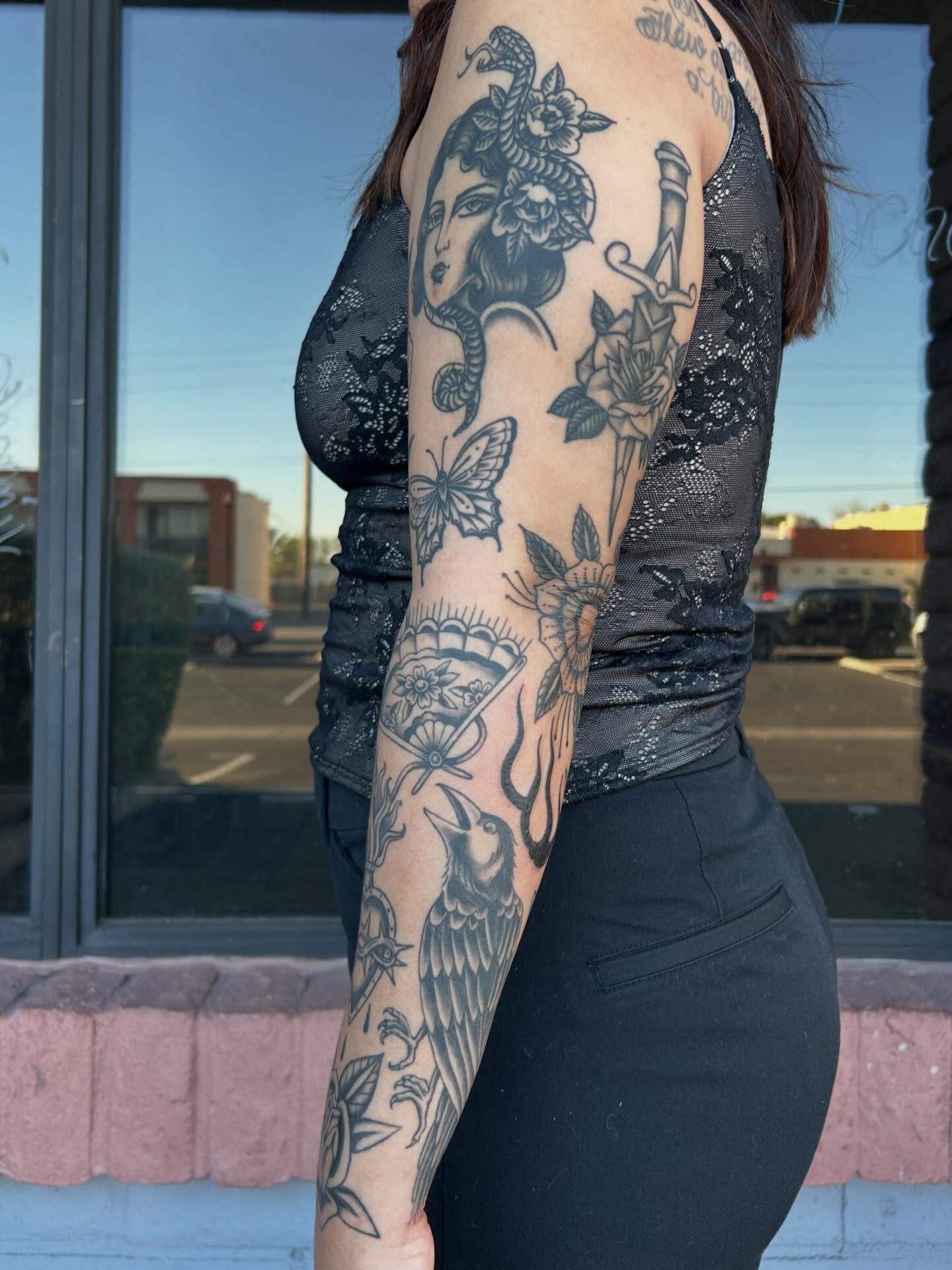Woman with snake American traditional tattoo on the forearm by Janelle McCarthy