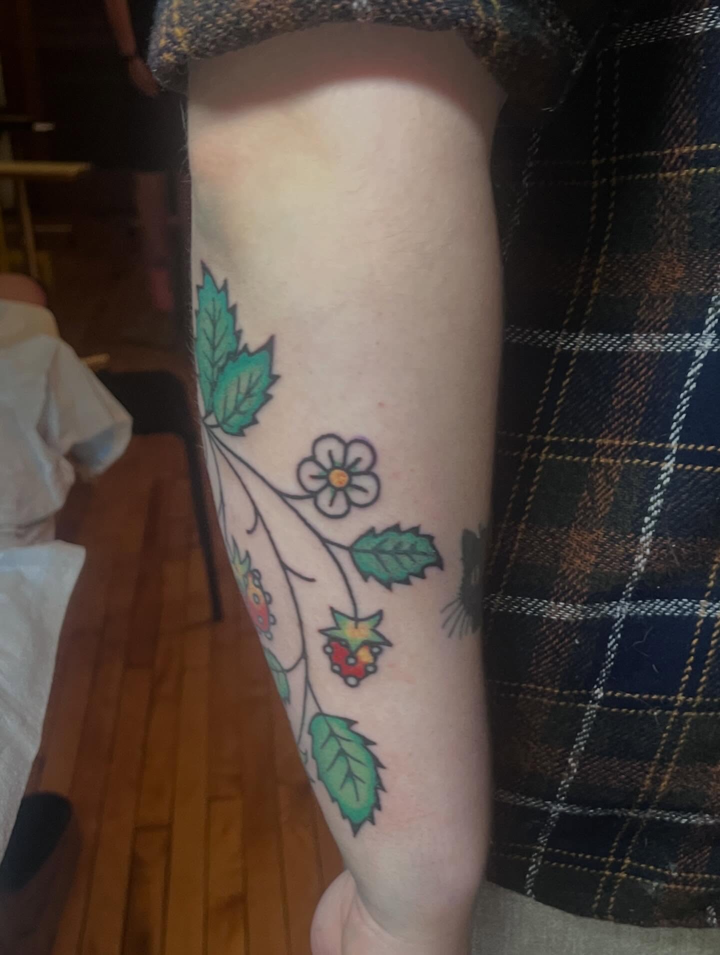 Flower and berries new school tattoo on the forearm by madelynne (maddie) caldwell tattoos