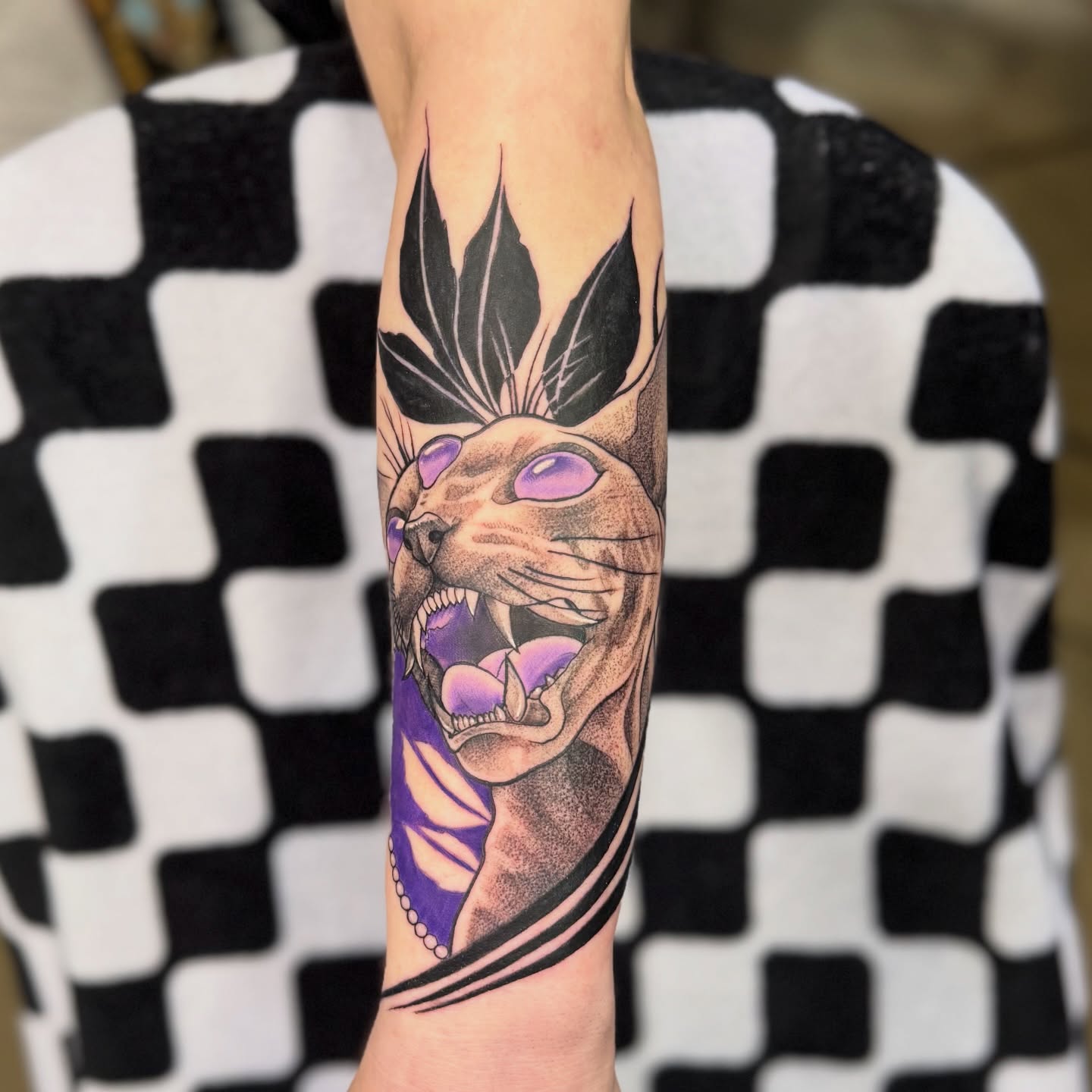 Cat realism tattoo on the forearm by Justin Hay