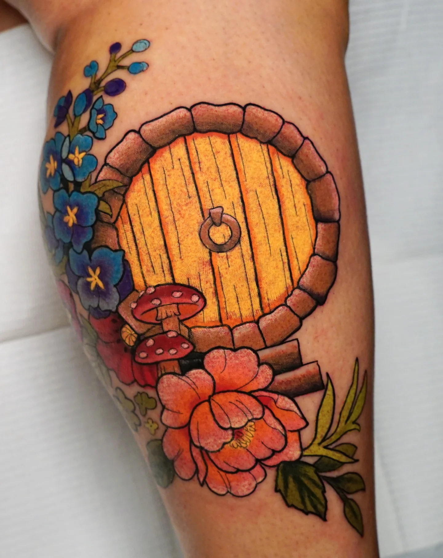 Door with flowers American traditional tattoo on the thigh by kylie, San Antonio, Texas