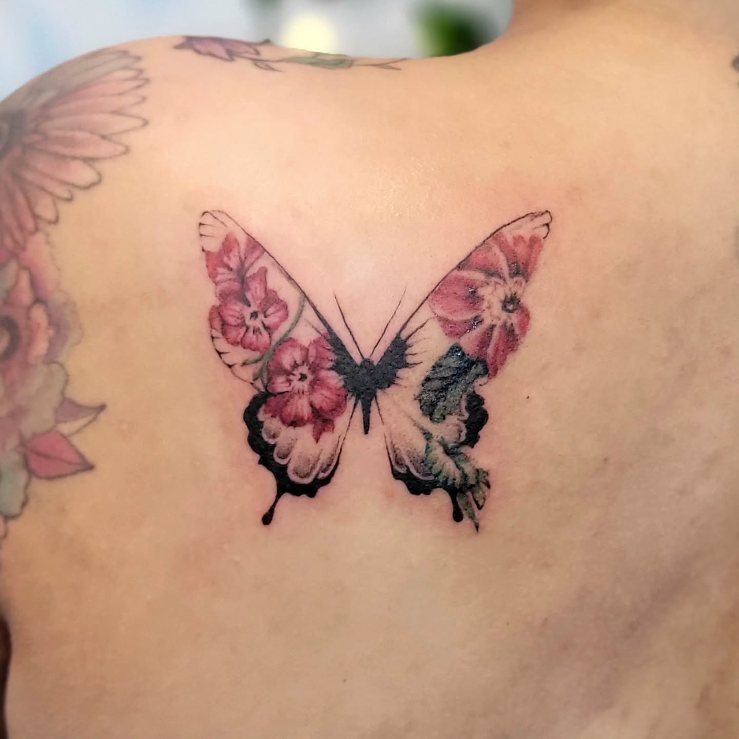 Butterfly realism tattoo on the back by Uku Tattoos, Cambridge, England