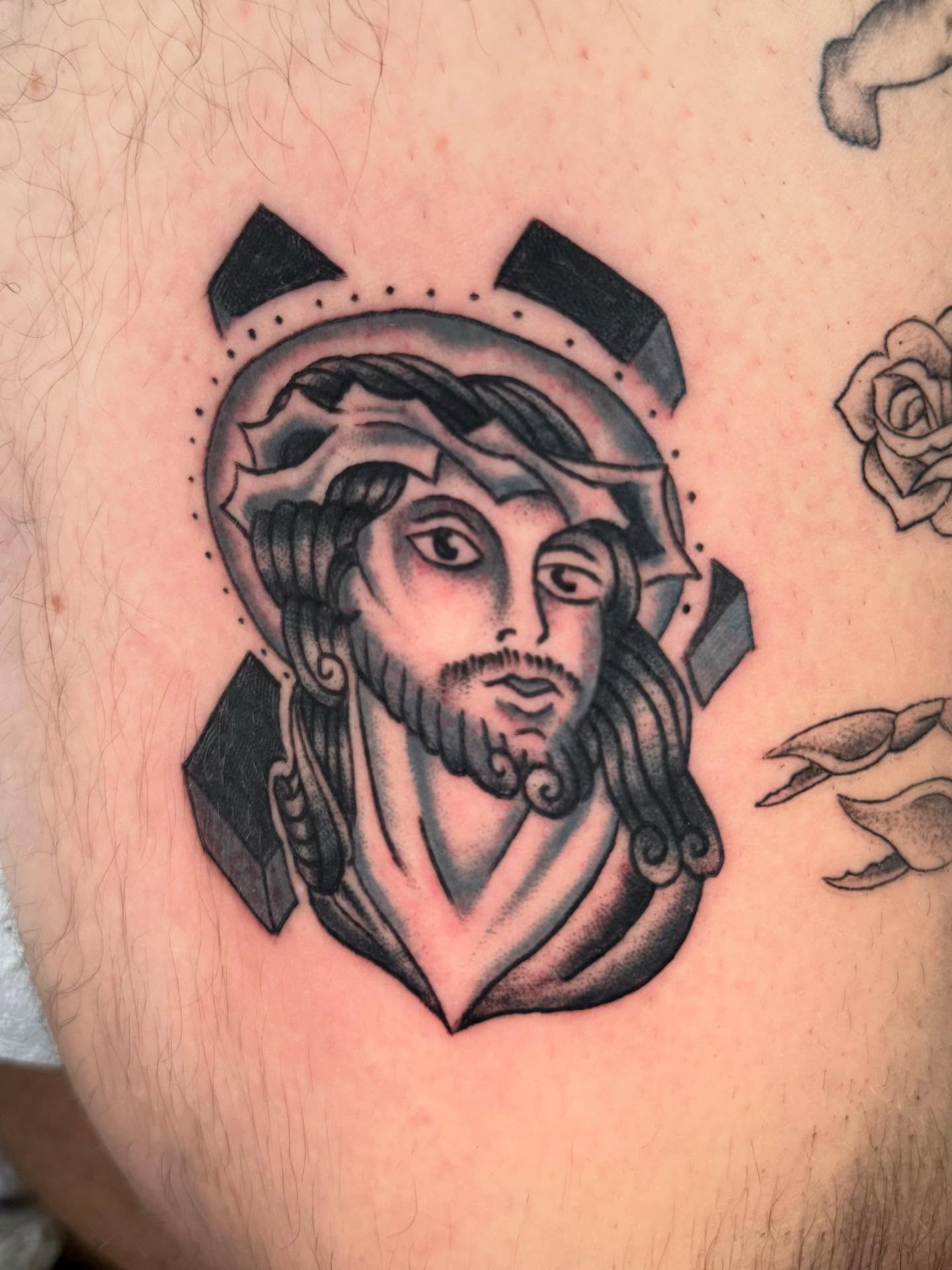 Religious figure American traditional tattoo on the thigh by Jesse Boss, Nashville, Tennessee