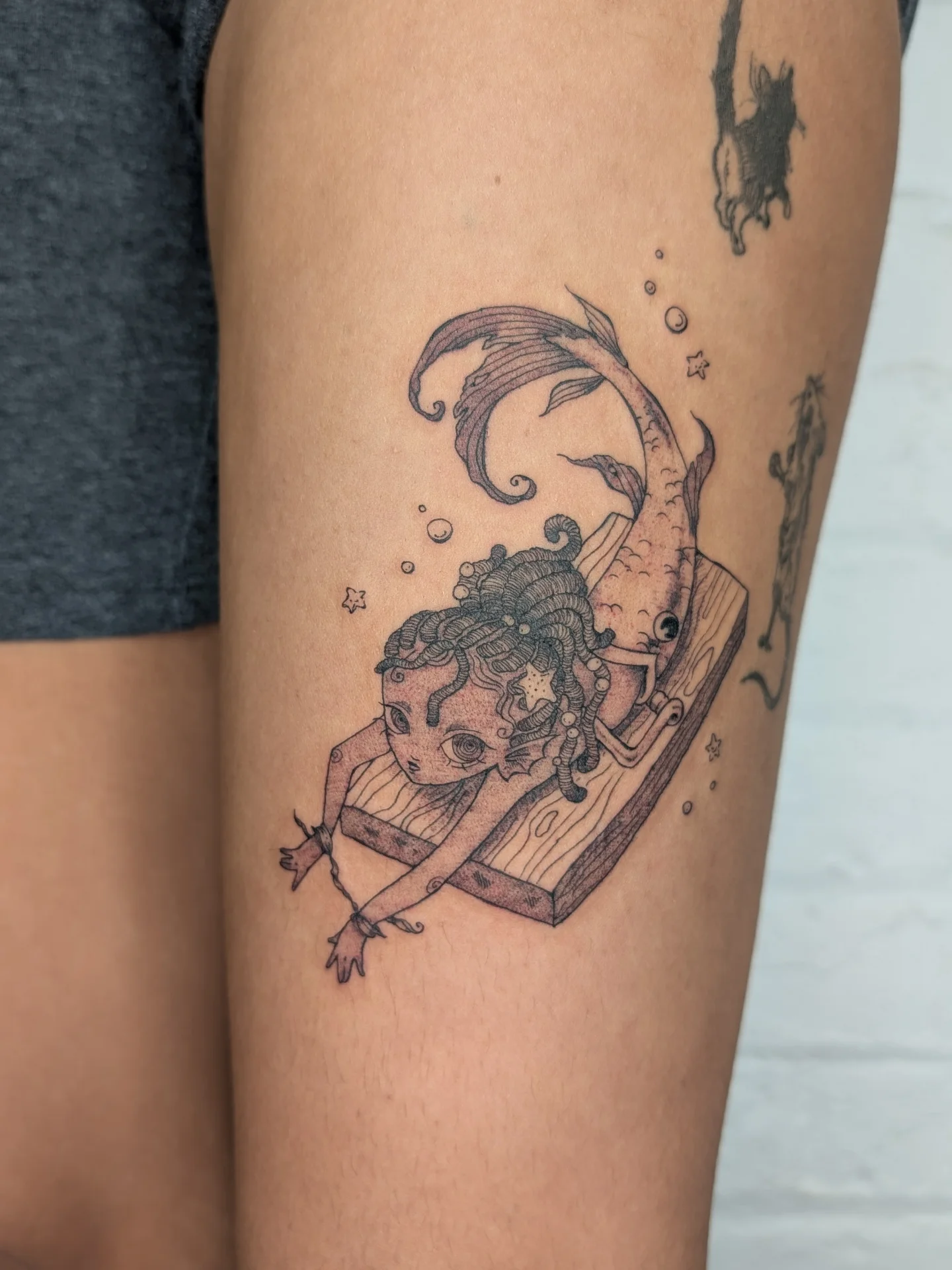 Mermaid and fish realism tattoo on the thigh by mila