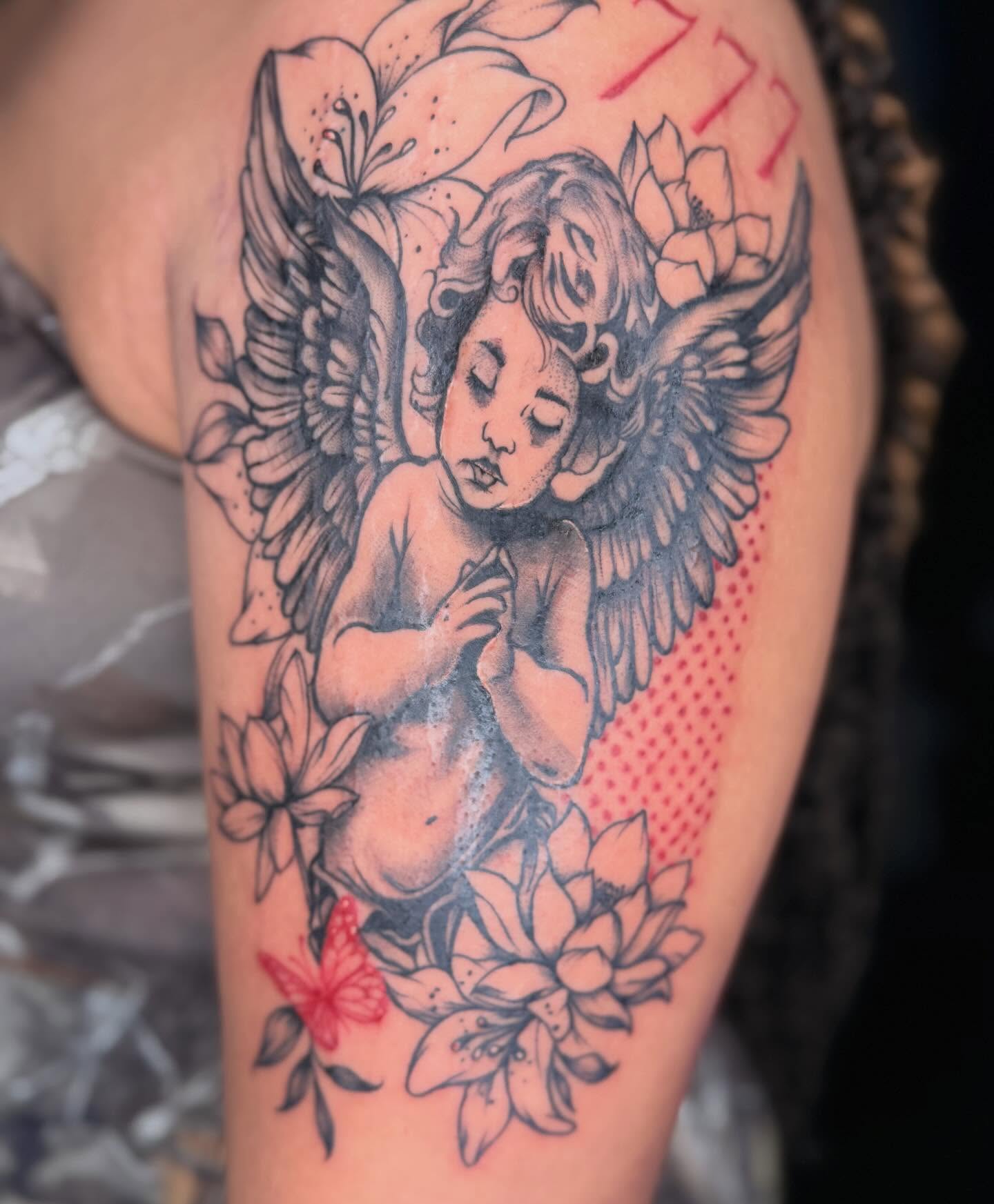 Cherub with wings American traditional tattoo on the thigh by Jazz Walker