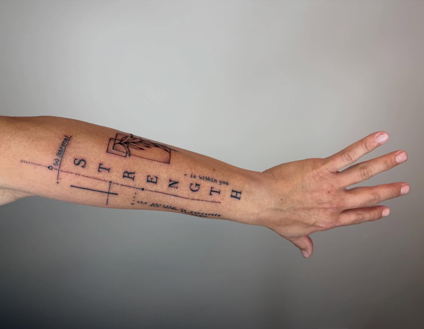 Strength lettering script tattoo on the forearm by Van Cleave Aesthetics, Franklin, Tennessee