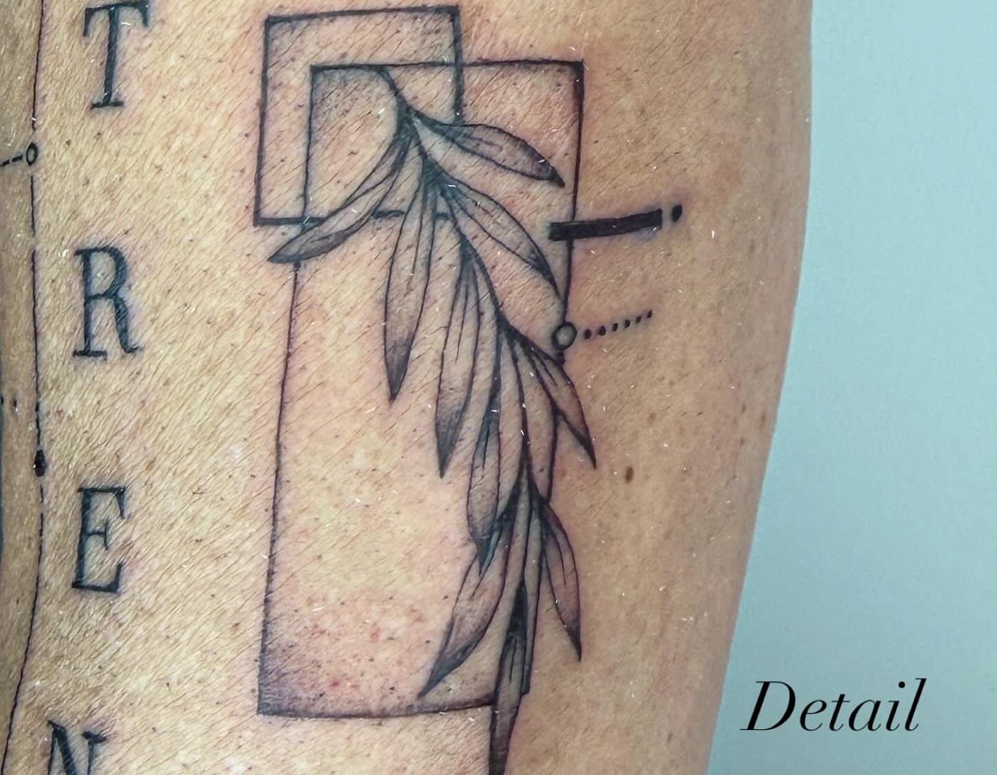 Cross with leaf black and grey tattoo on the forearm by Van Cleave Aesthetics, Franklin, Tennessee