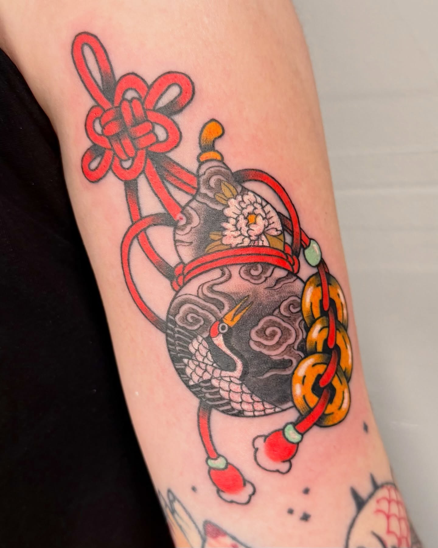 Crane and knot American traditional tattoo on the forearm by binh
