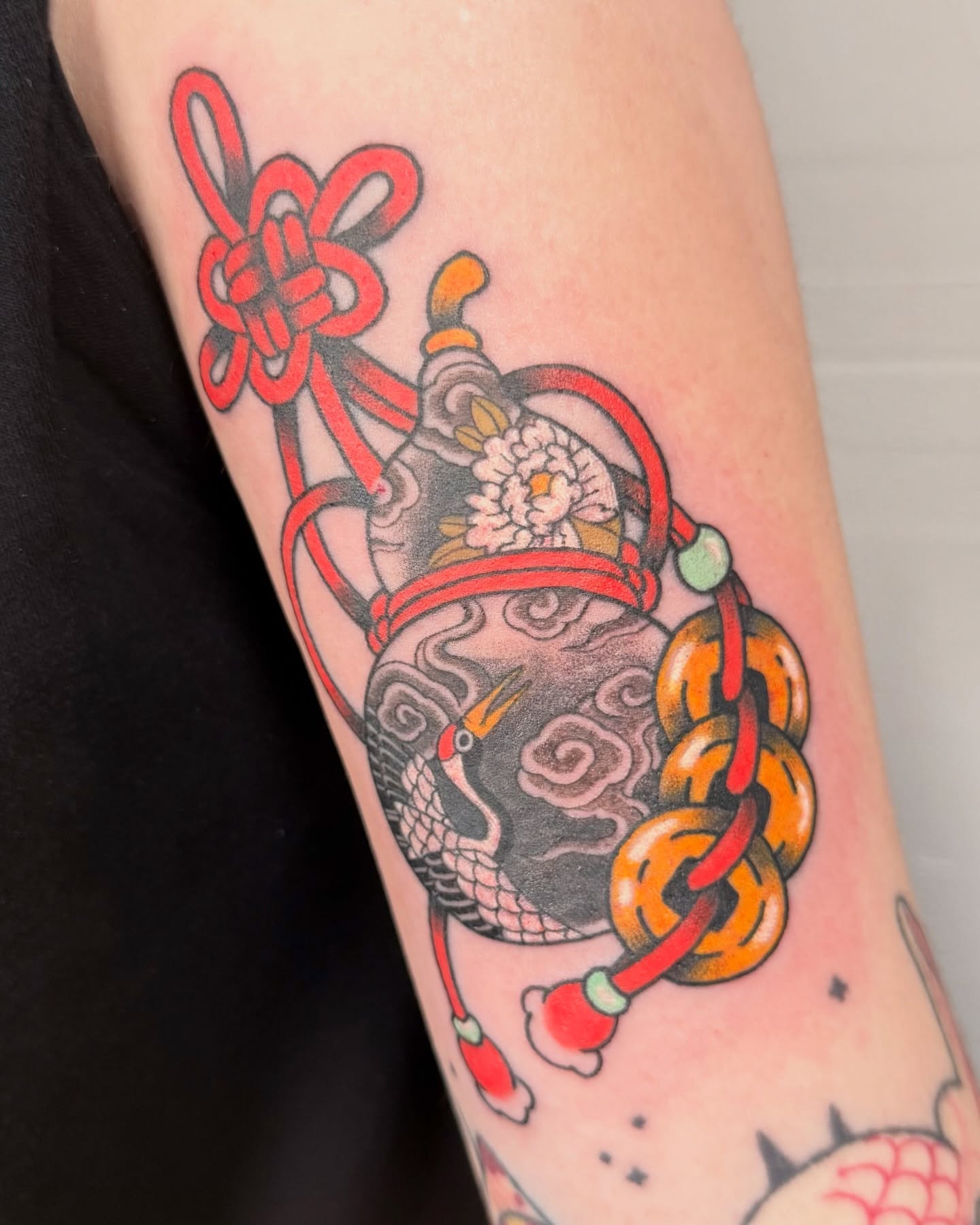 Crane and knot American traditional tattoo on the forearm by binh