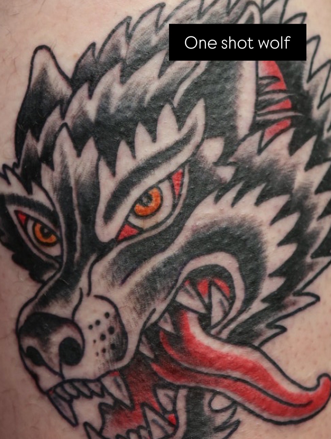 Wolf American traditional tattoo on the forearm by Chris Cockrill