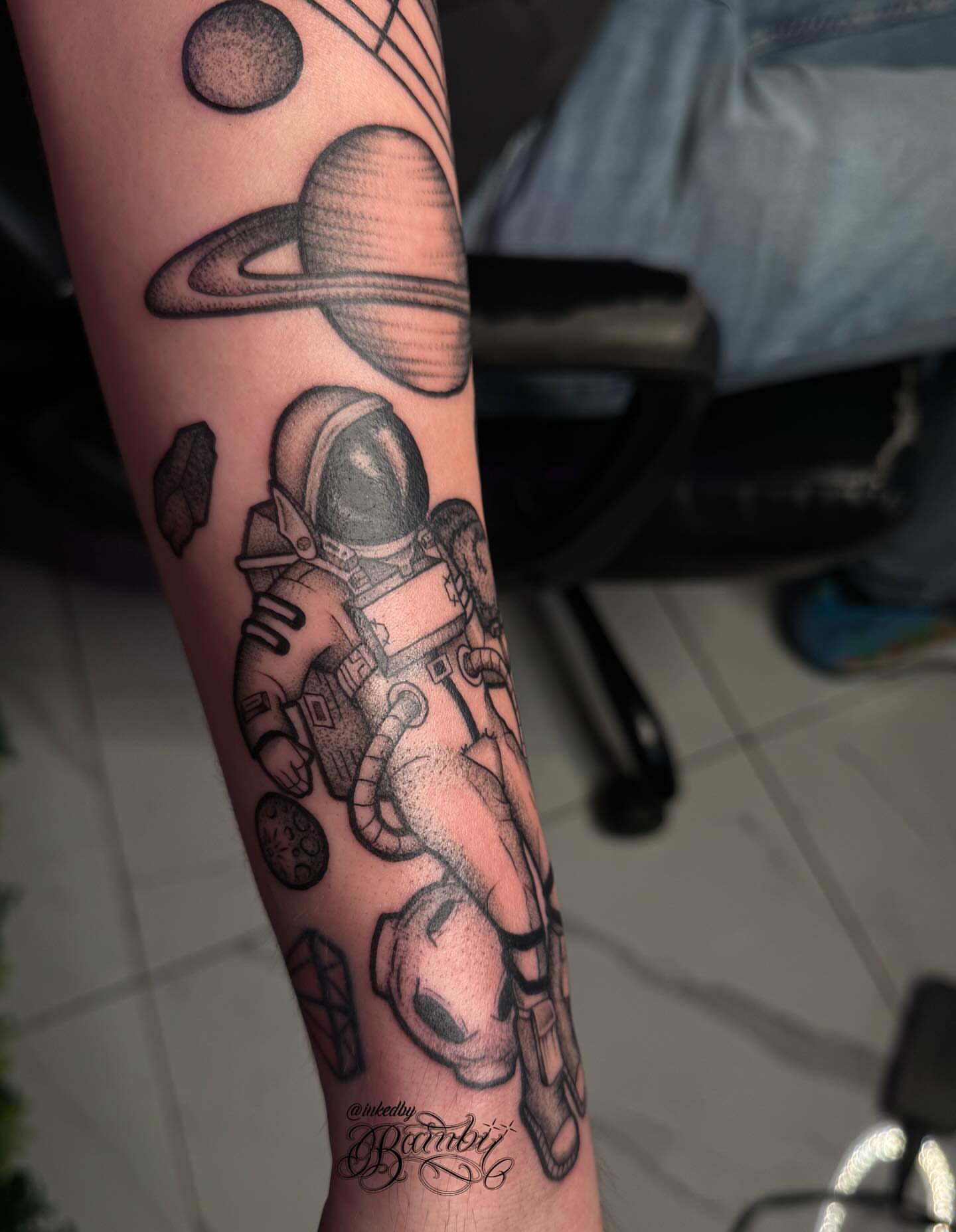 Astronaut dotwork tattoo on the forearm by Ember