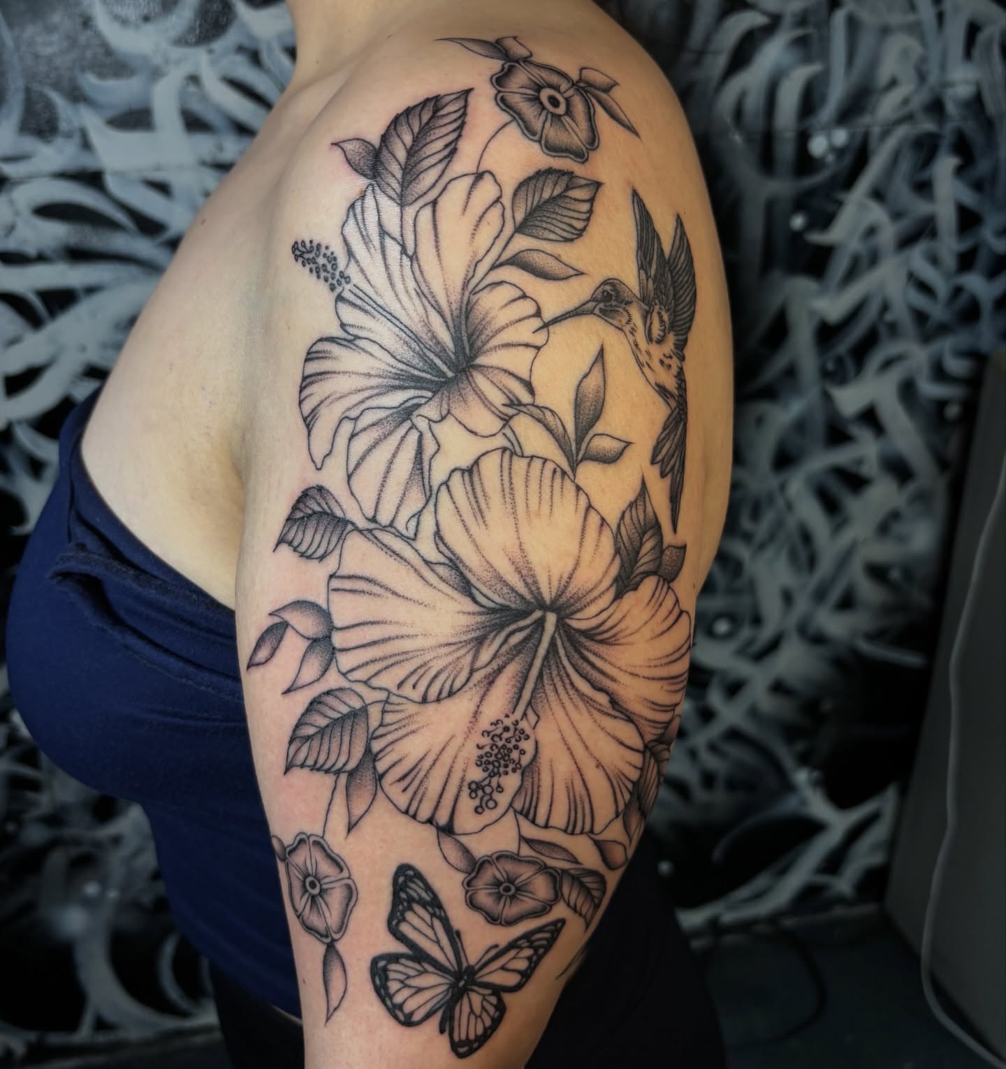 Hibiscus flowers and hummingbird realism tattoo on the shoulder by Miklo Montoya