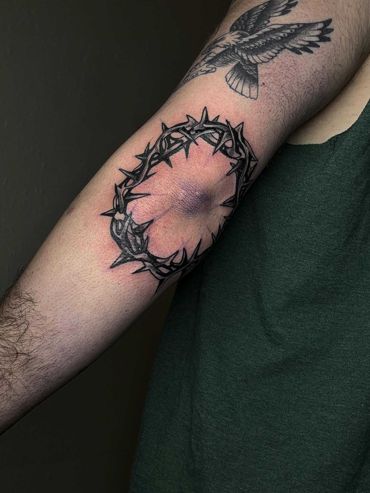 Crown of thorns black and grey tattoo on the forearm by Grace L
