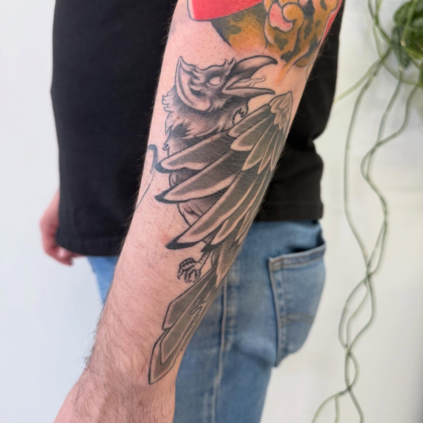 Crow black and grey tattoo on the forearm by Kaitlyn Brebner