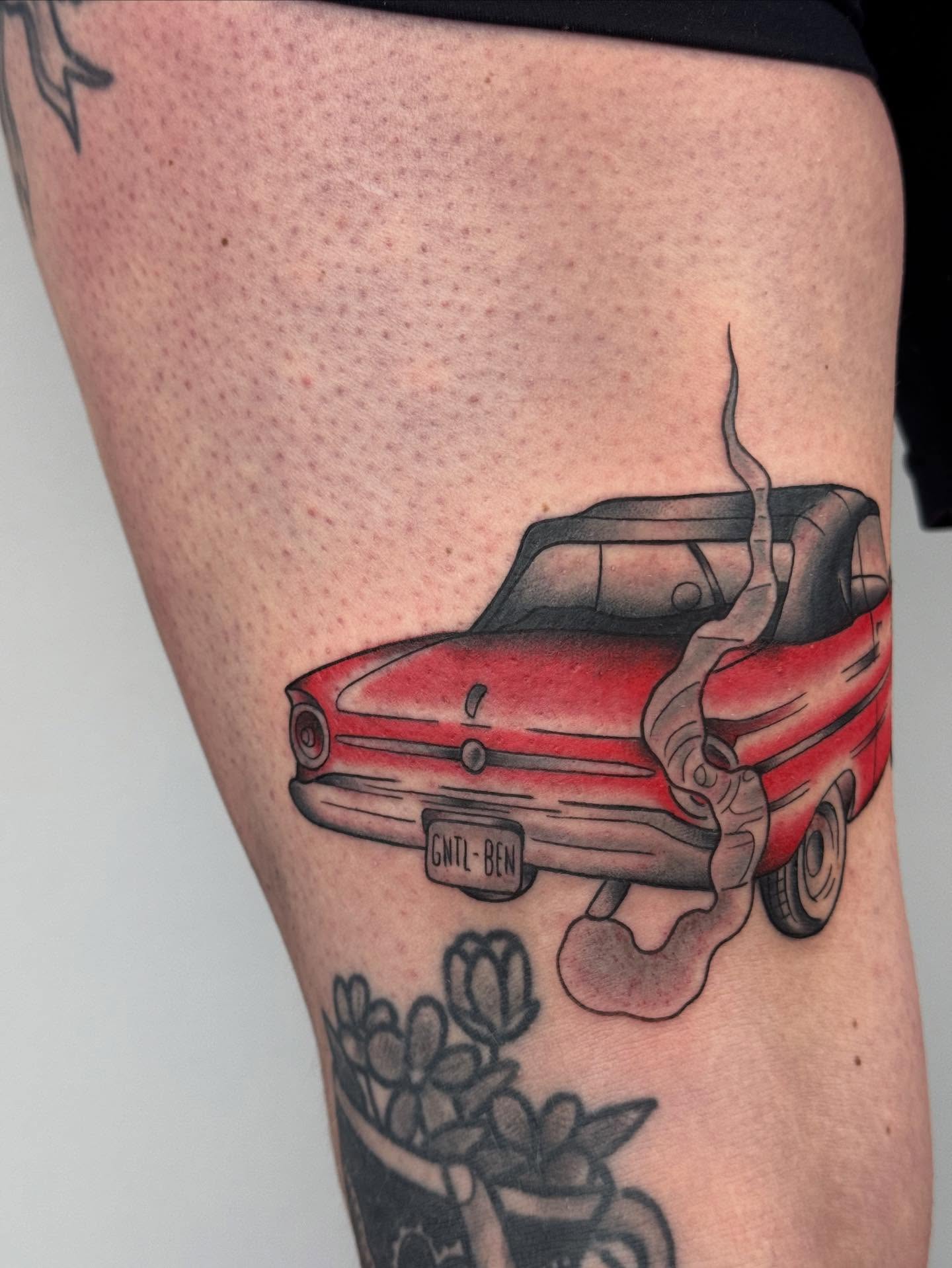 Red car American traditional tattoo on the thigh by π©πͺπ¬