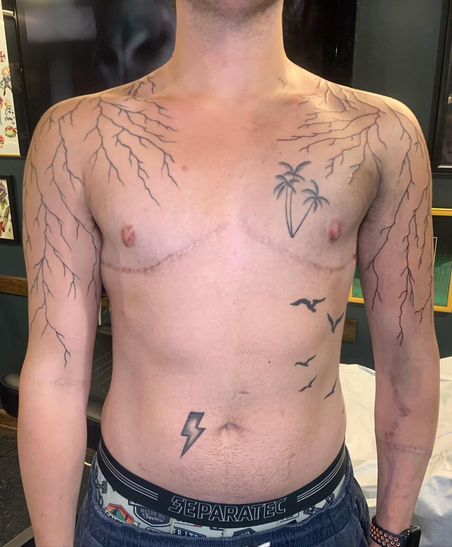 Lightning bolts and birds realism tattoo on the chest by Hannah Hahn