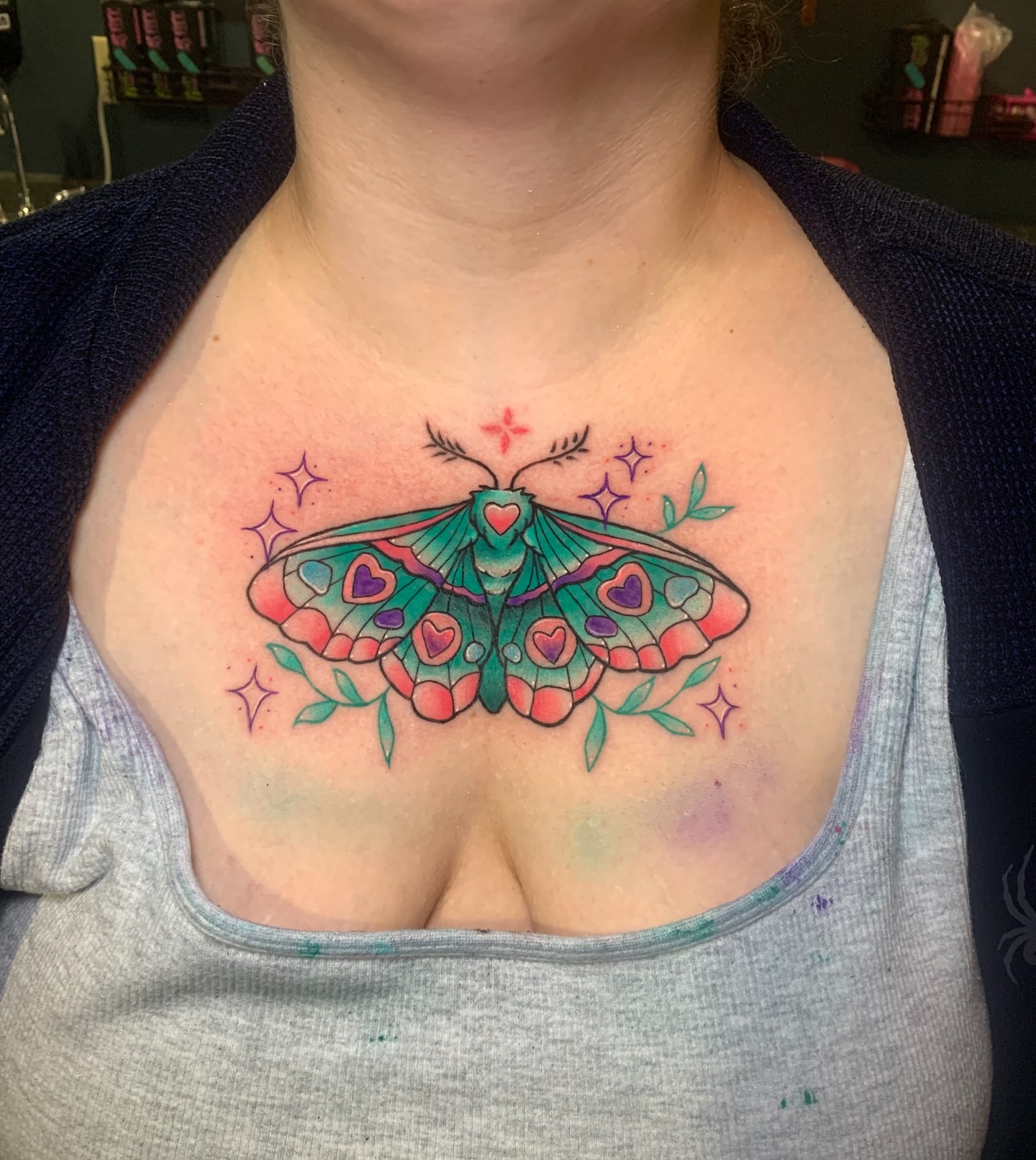 Moth new school tattoo on the chest by Aubrianna Grisez