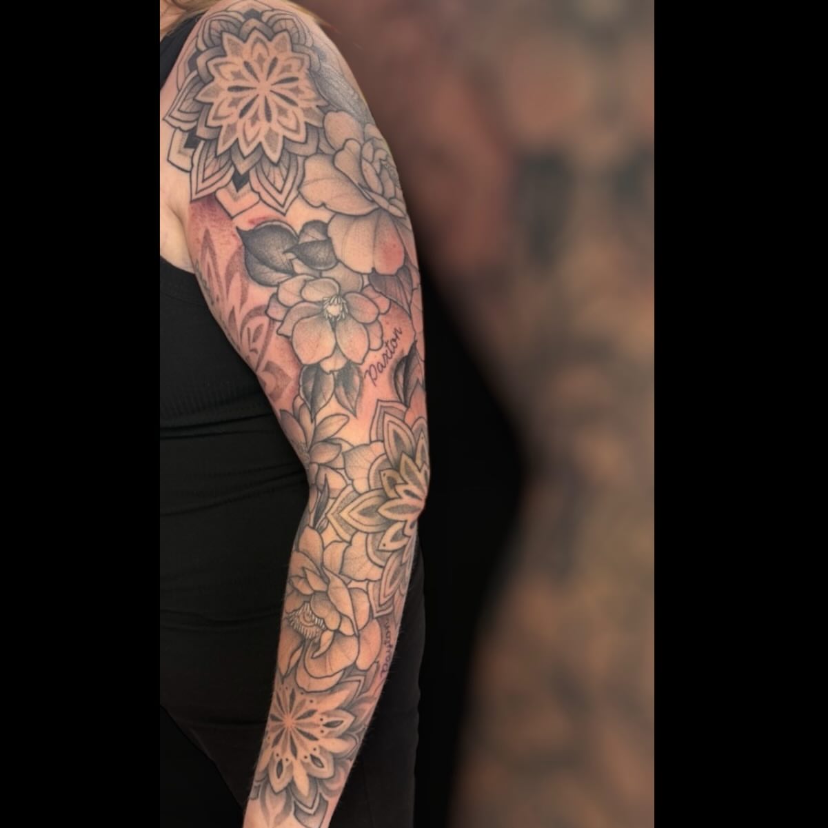 Floral mandala neo-traditional tattoo on the upper arm by Dameetra Davis