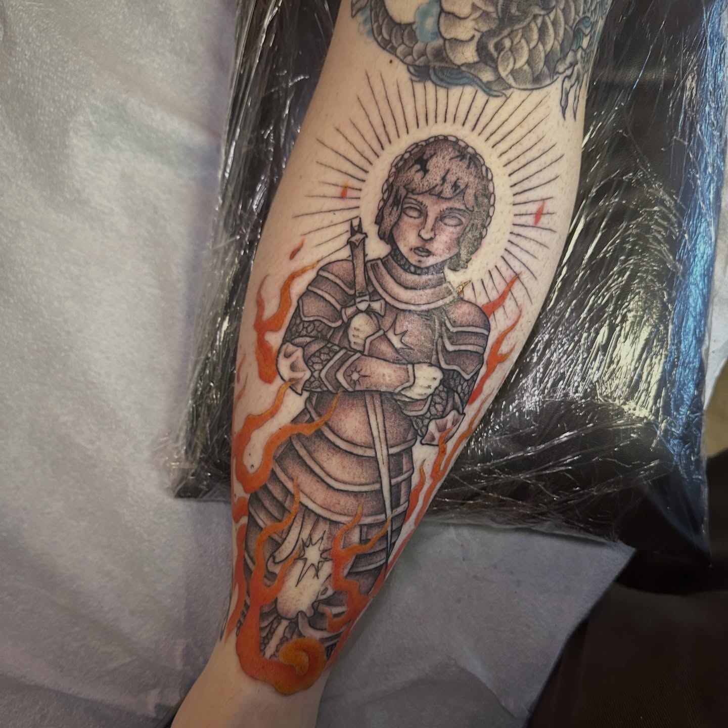 Child in armor black and grey tattoo on the forearm by Luisa Gonzalez, Austin, Texas