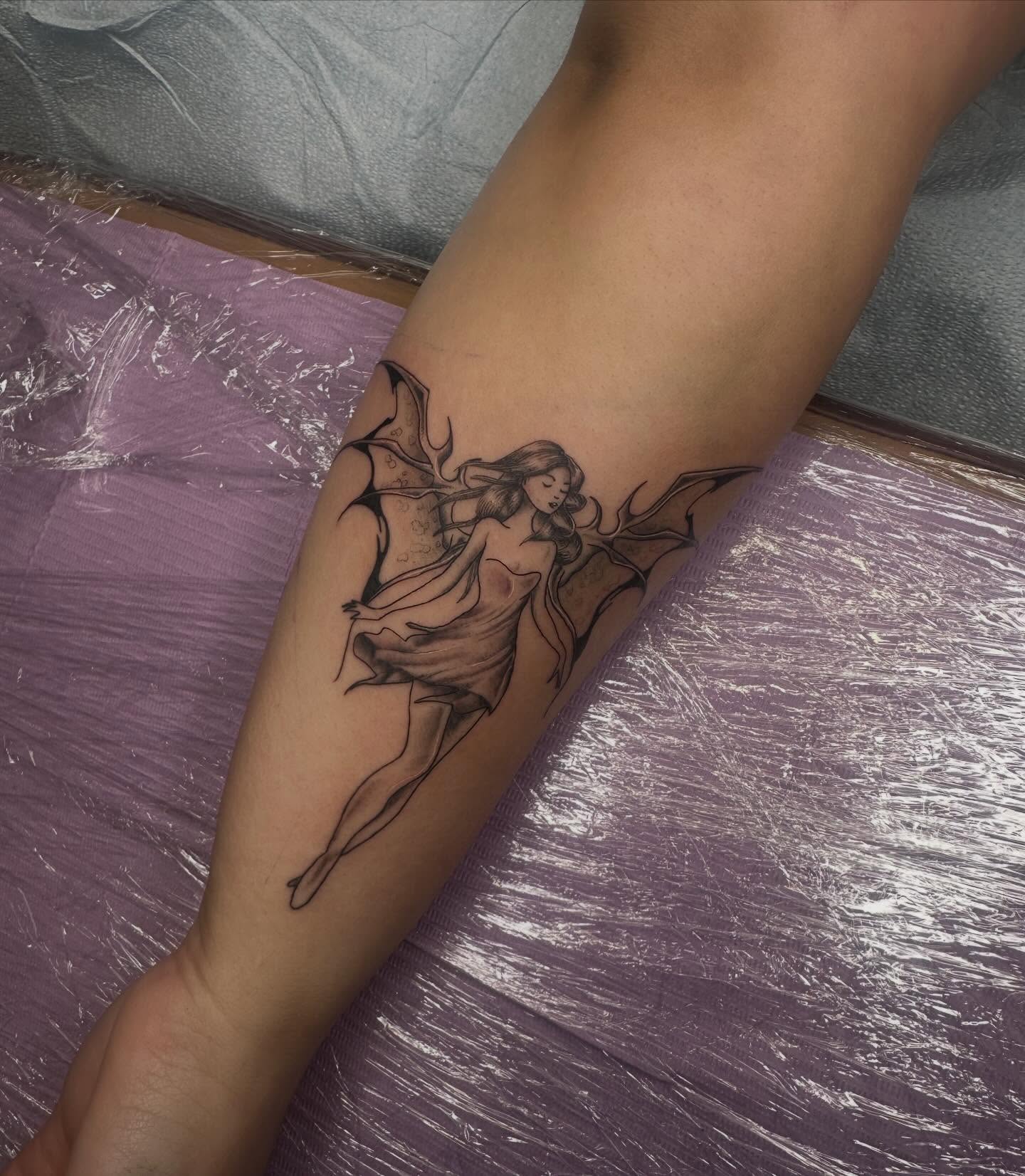 Fairy black and grey tattoo on the forearm by Alex Gunshefski