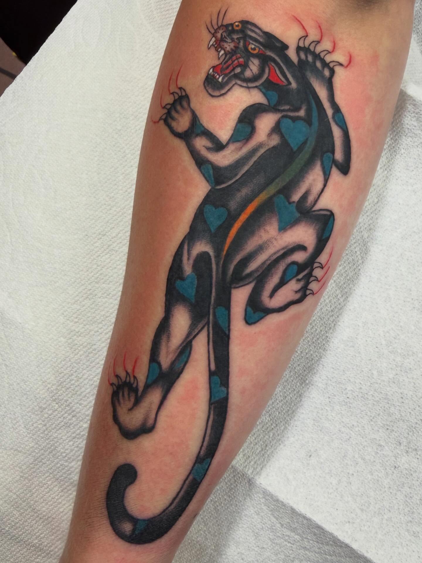 Panther American traditional tattoo on the forearm by David Evans