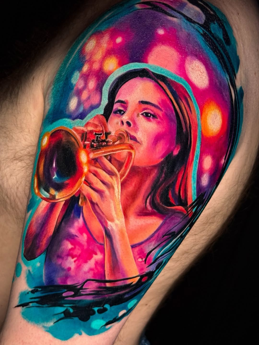 Woman playing trumpet surrealism tattoo on the shoulder by Amy Zager