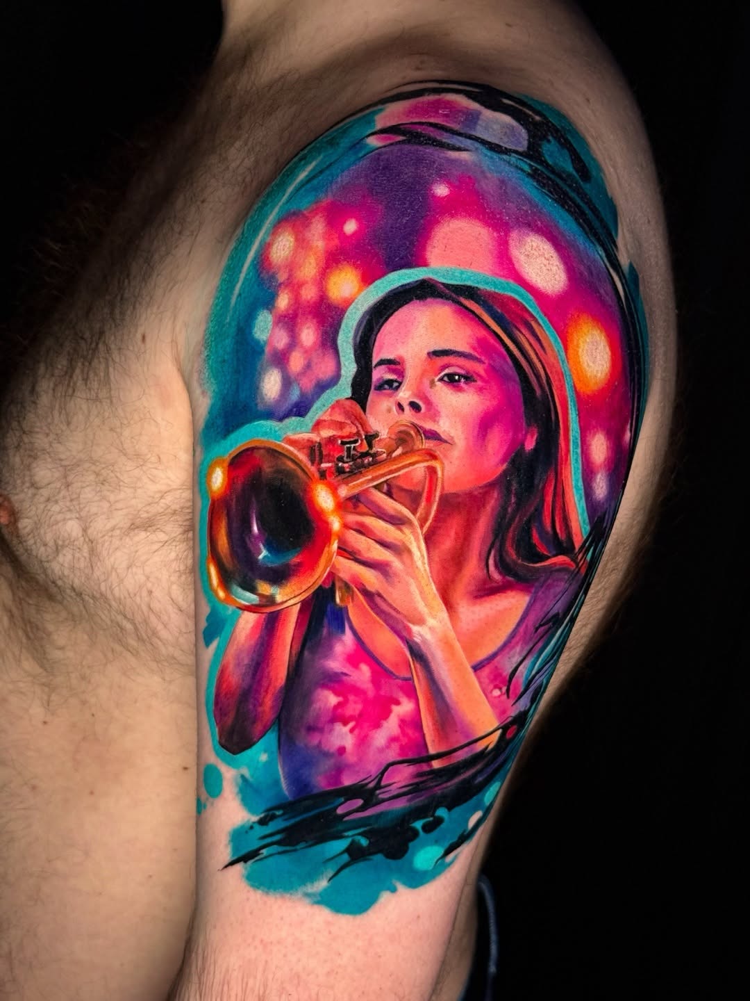 Woman playing trumpet surrealism tattoo on the shoulder by Amy Zager