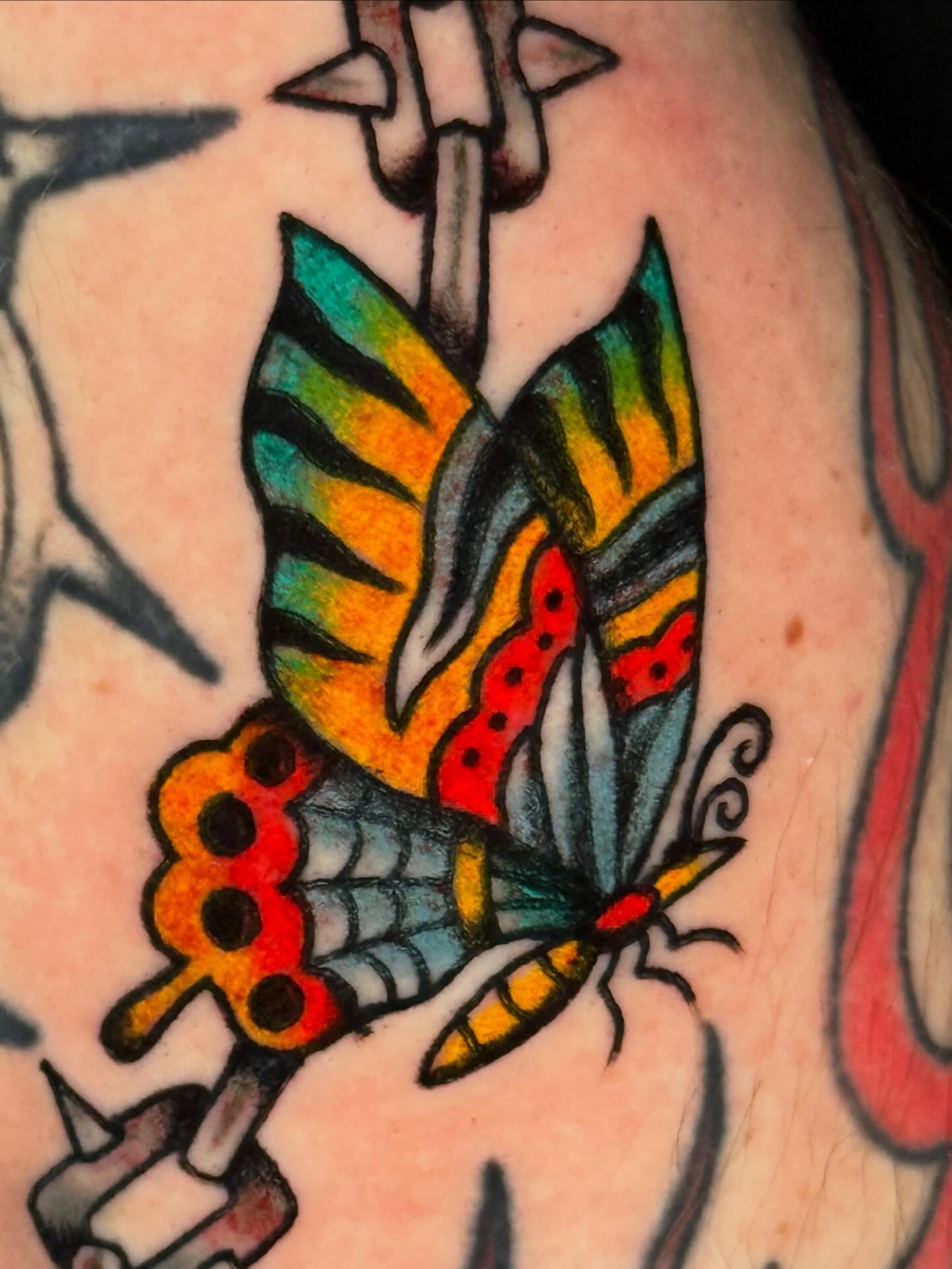 Butterfly American traditional tattoo on the back by Mallory Brown