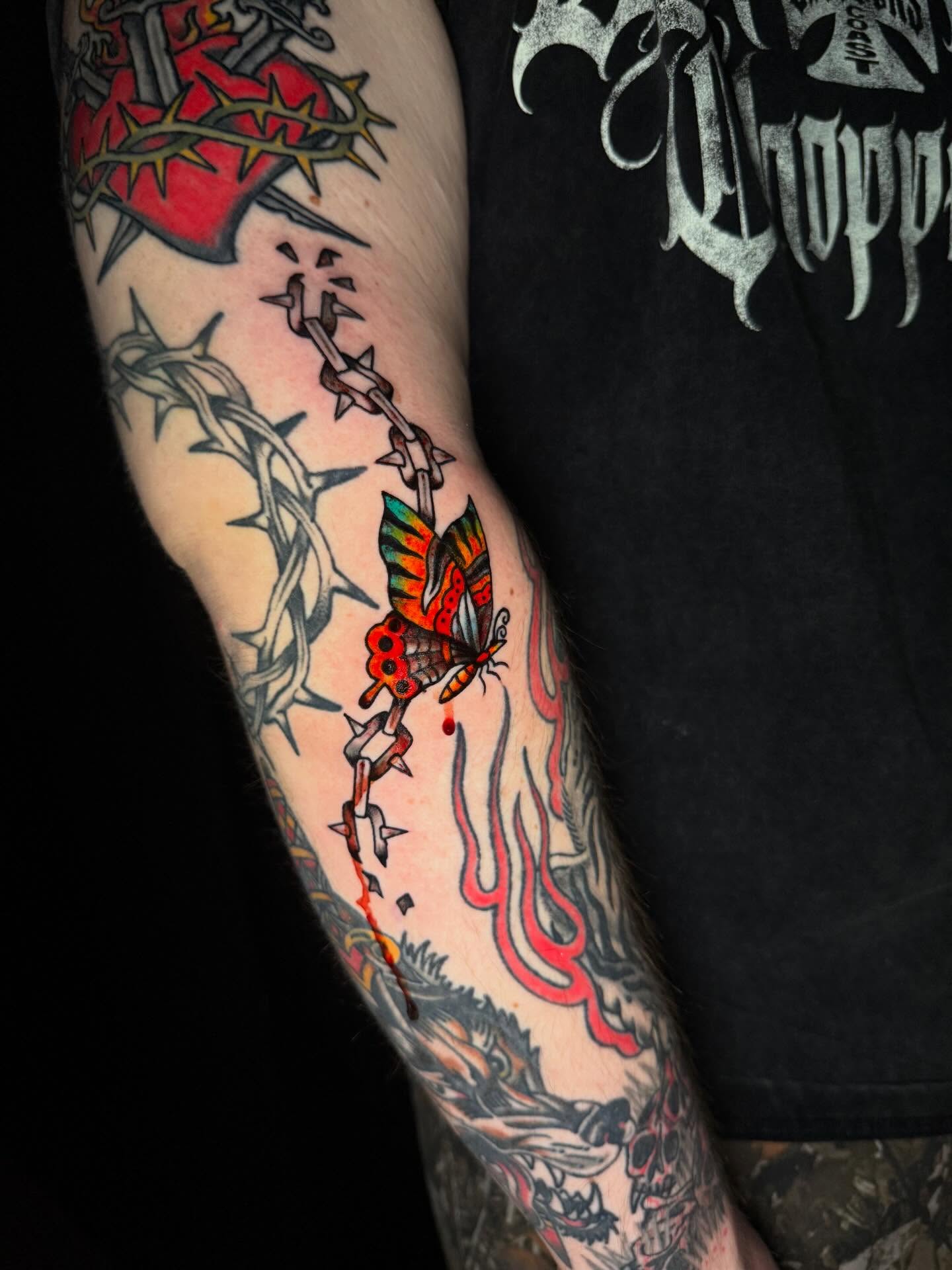 Butterfly neo-traditional tattoo on the forearm by Mallory Brown