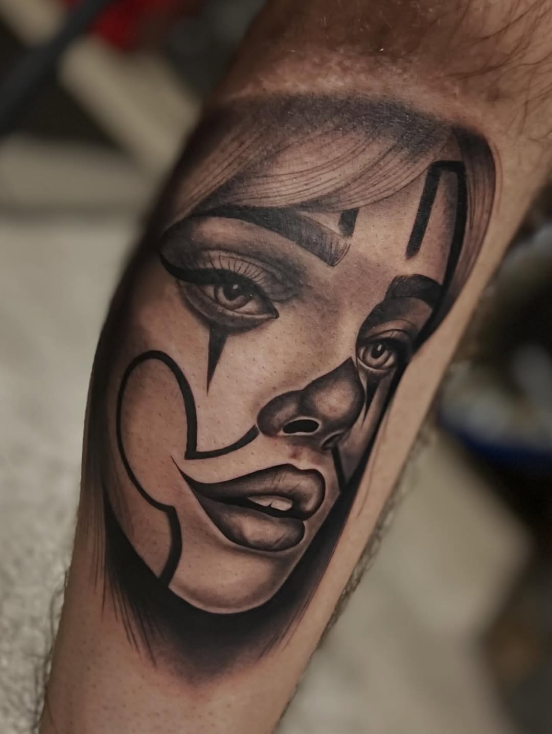 Clown face portrait Chicano tattoo on the forearm by Dallas tx tattoo artist ✝️