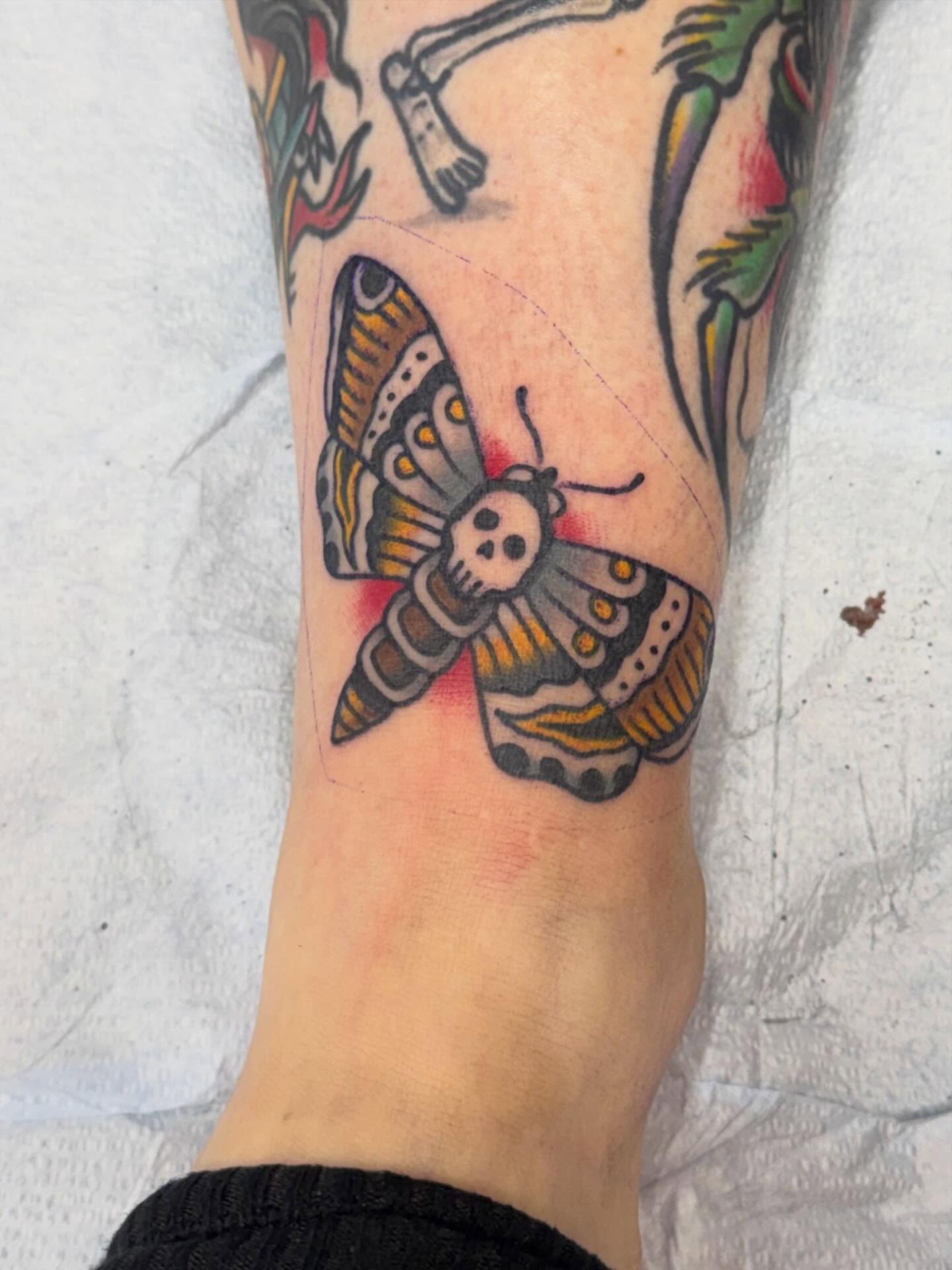 Butterfly with skull American traditional tattoo on the forearm by Matt Paw