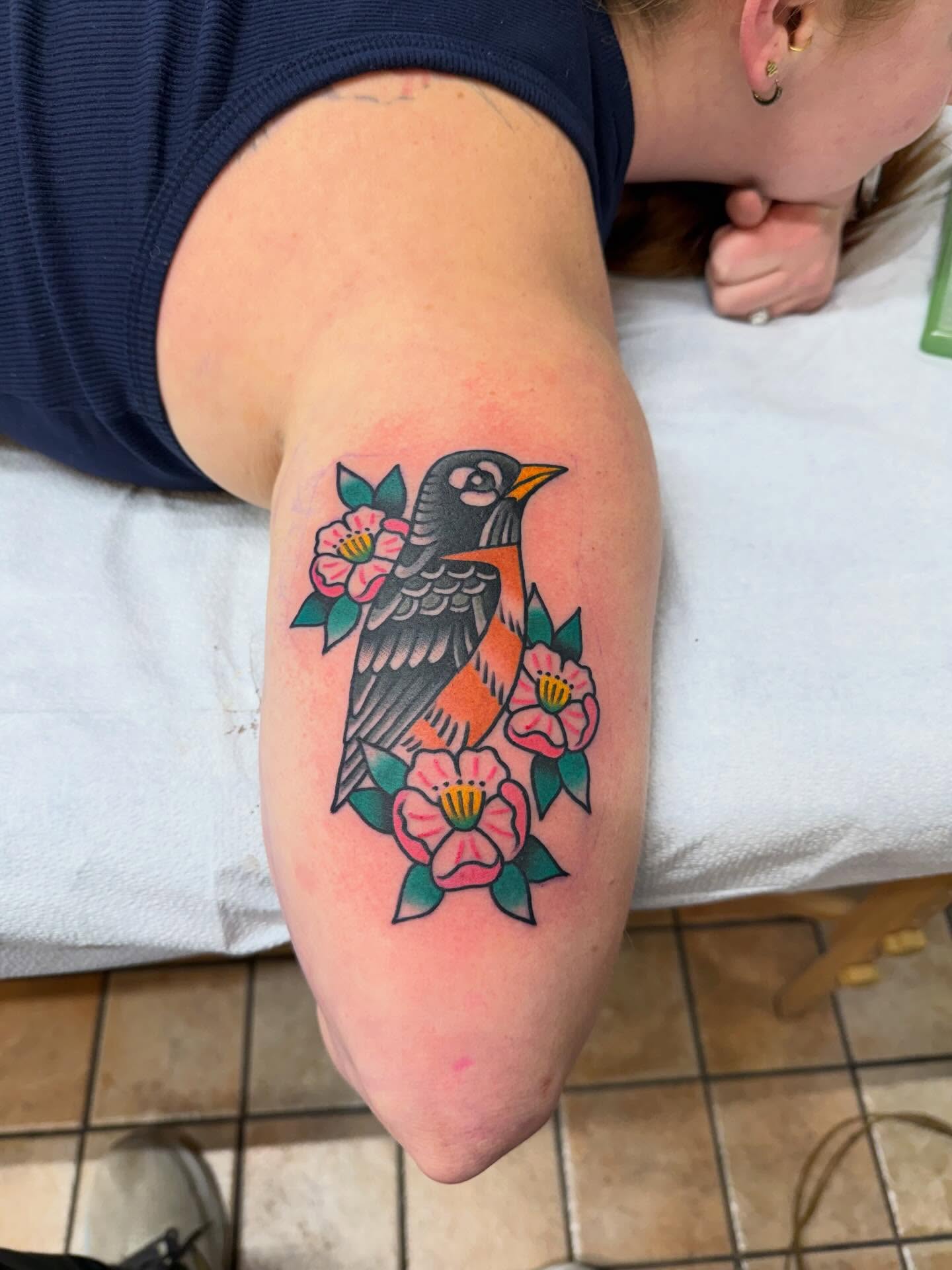 Bird and flowers American traditional tattoo on the forearm by Matt Paw