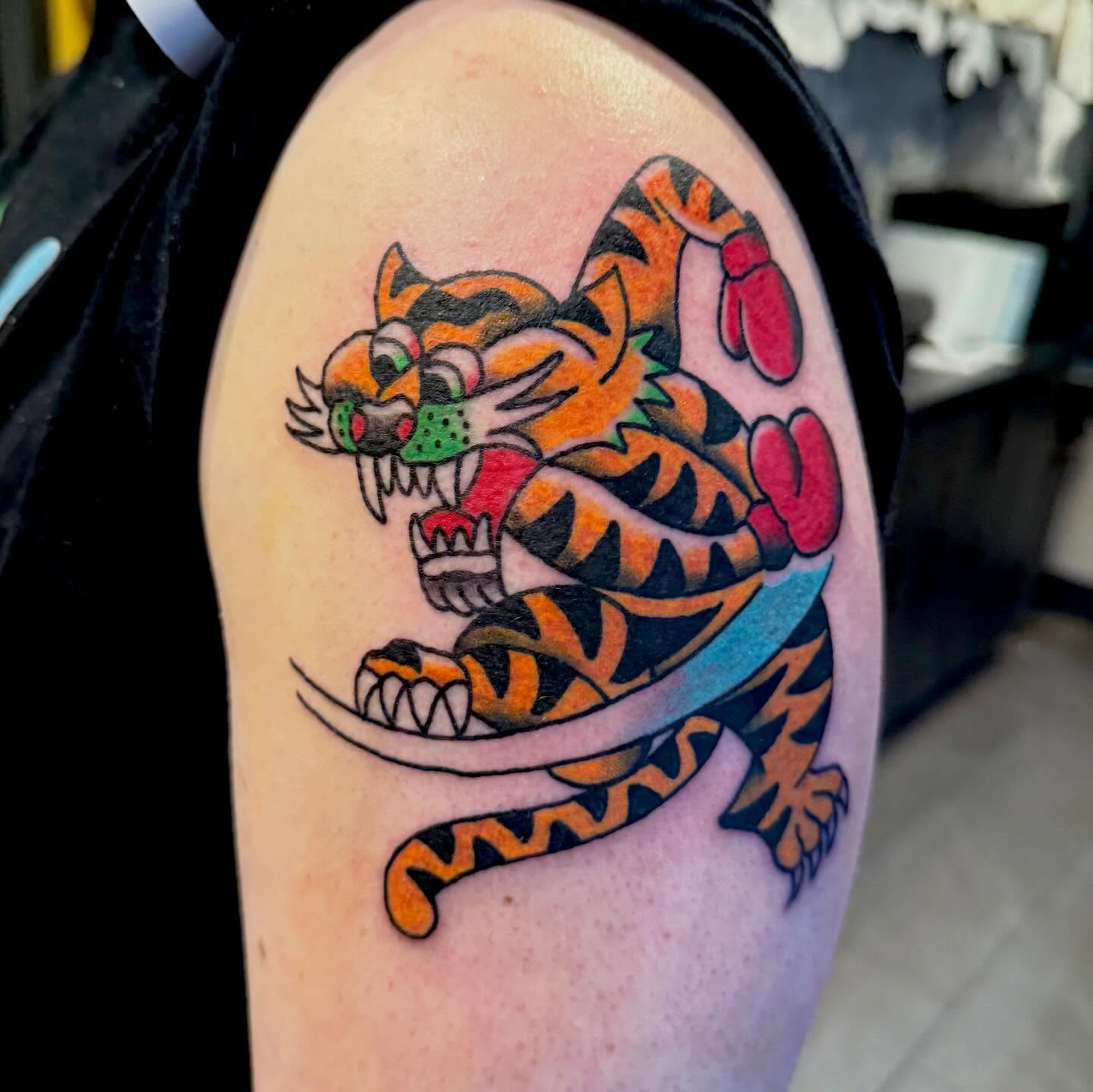 Tiger American traditional tattoo on the shoulder by Henry Bubula, Minneapolis, Minnesota