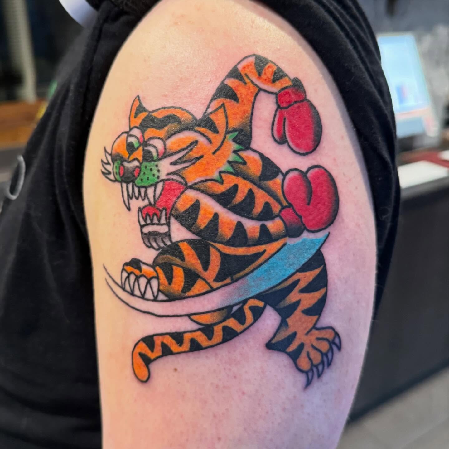 Tiger American traditional tattoo on the shoulder by Henry Bubula, Minneapolis, Minnesota