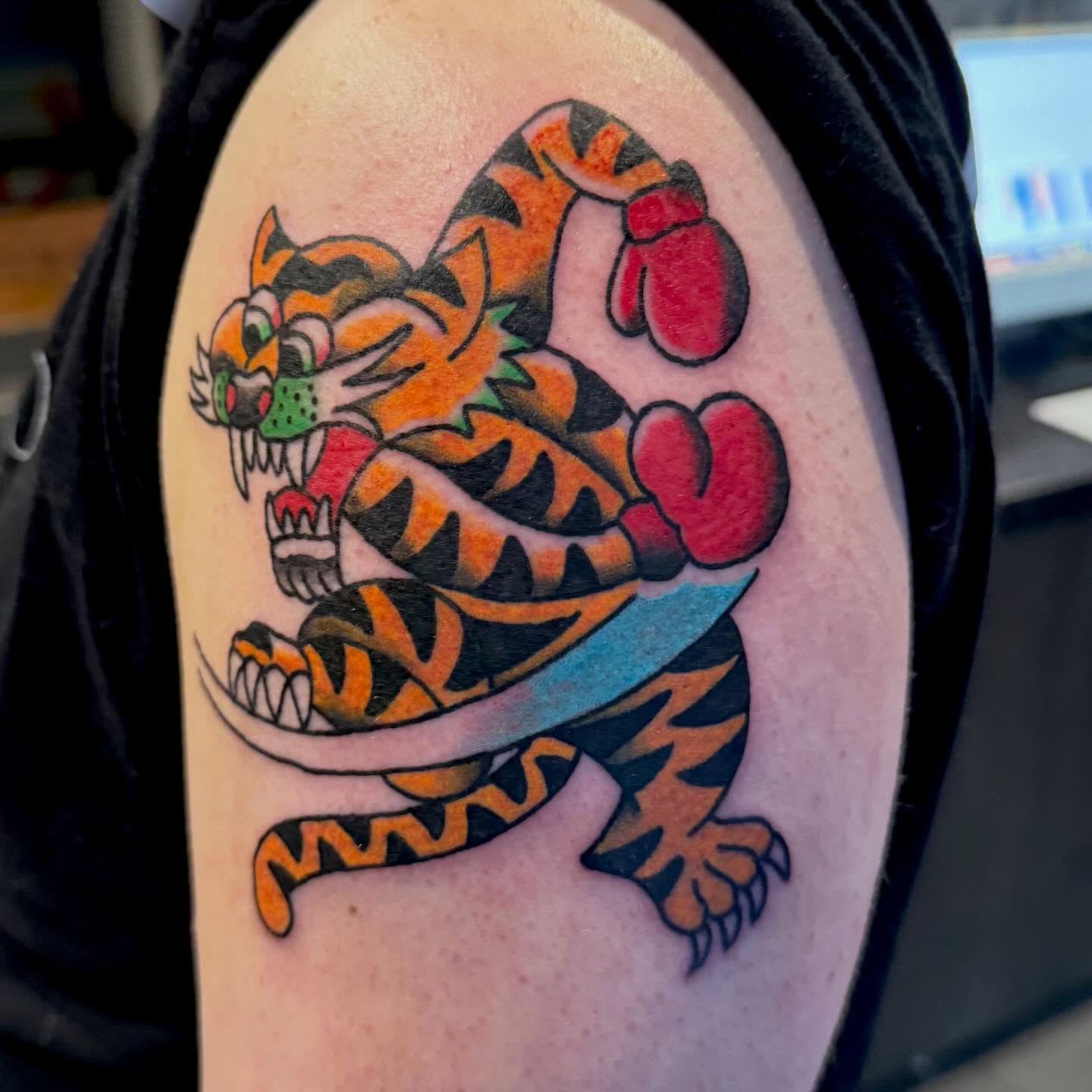 Tiger American traditional tattoo on the shoulder by Henry Bubula, Minneapolis, Minnesota