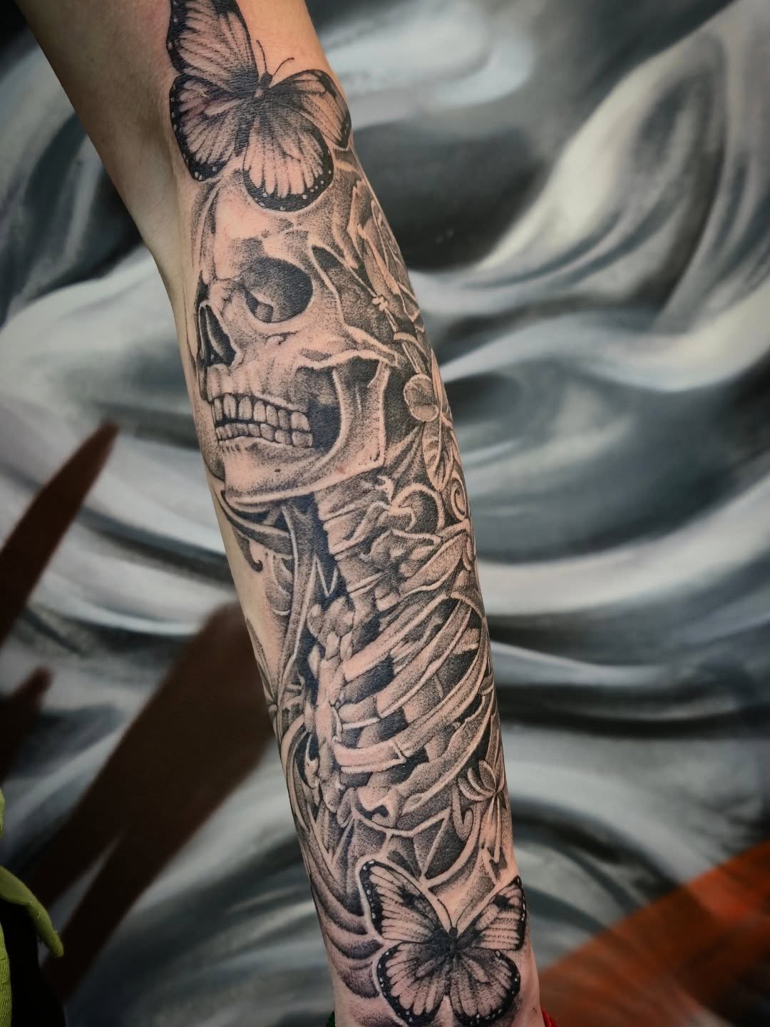Skull and butterflies realism tattoo on the forearm by Тату Херсон _ Kherson tattoo, Kherson