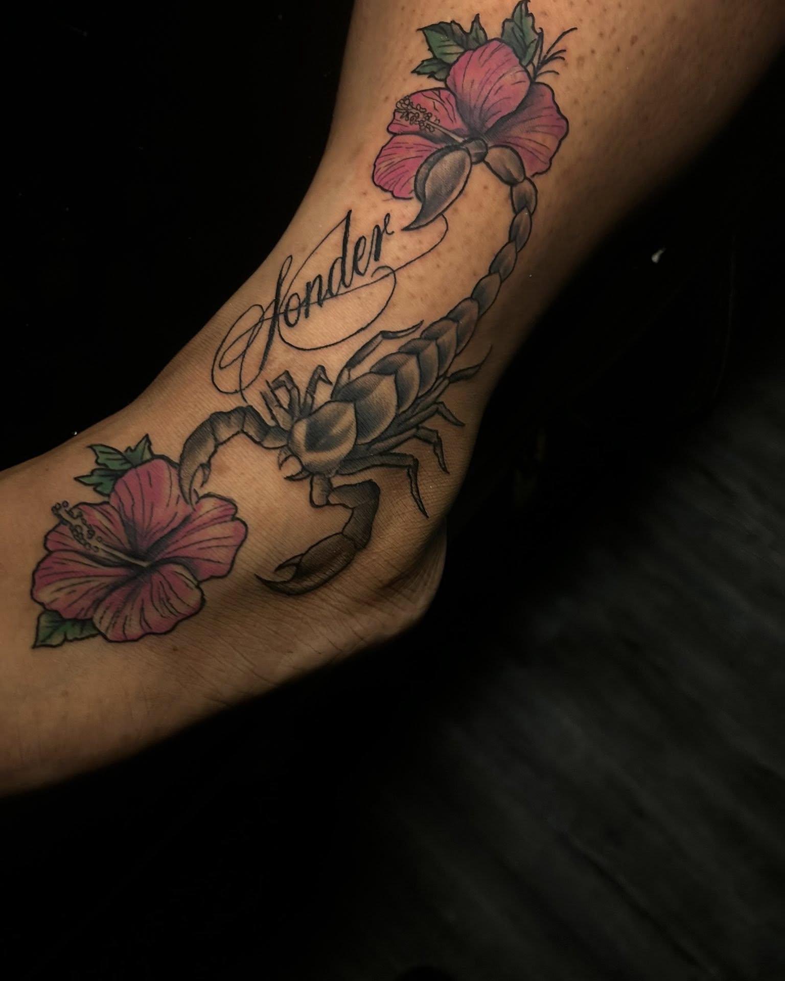 Scorpion and hibiscus American traditional tattoo on the forearm by Ferlandis Fitch, Long Beach, California