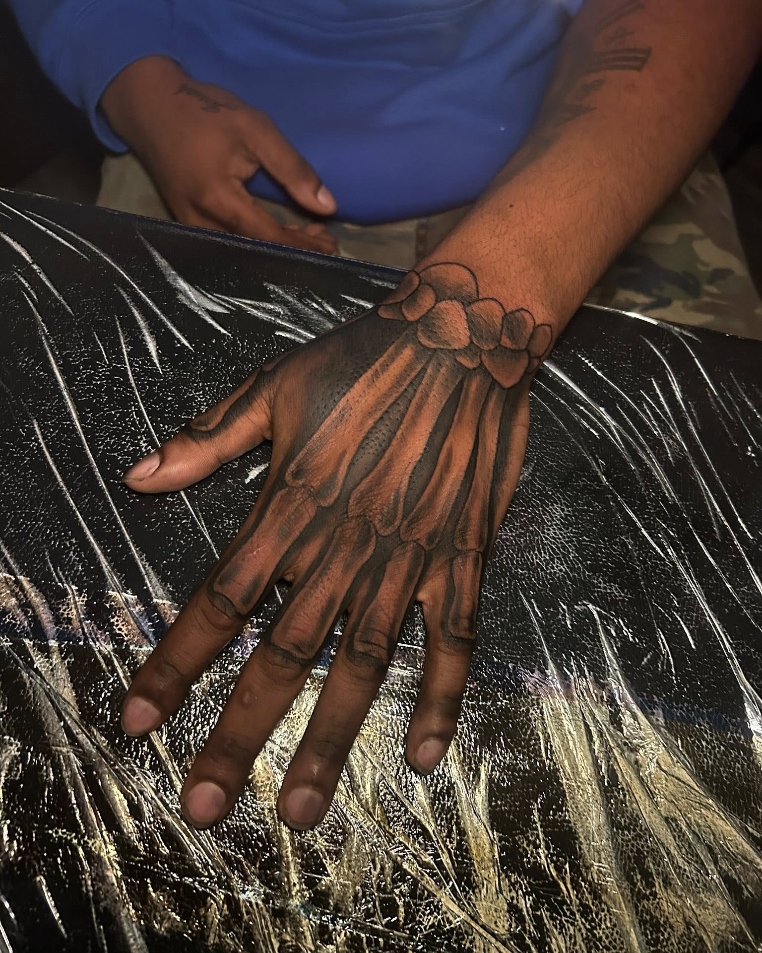 Skeleton hand realism tattoo on the hand by Ferlandis Fitch, Long Beach, California