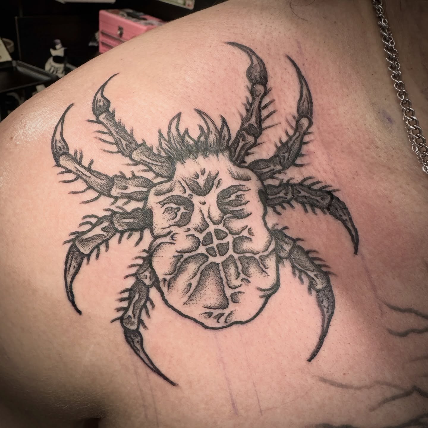 Crab dotwork tattoo on the shoulder by Seth Christianson