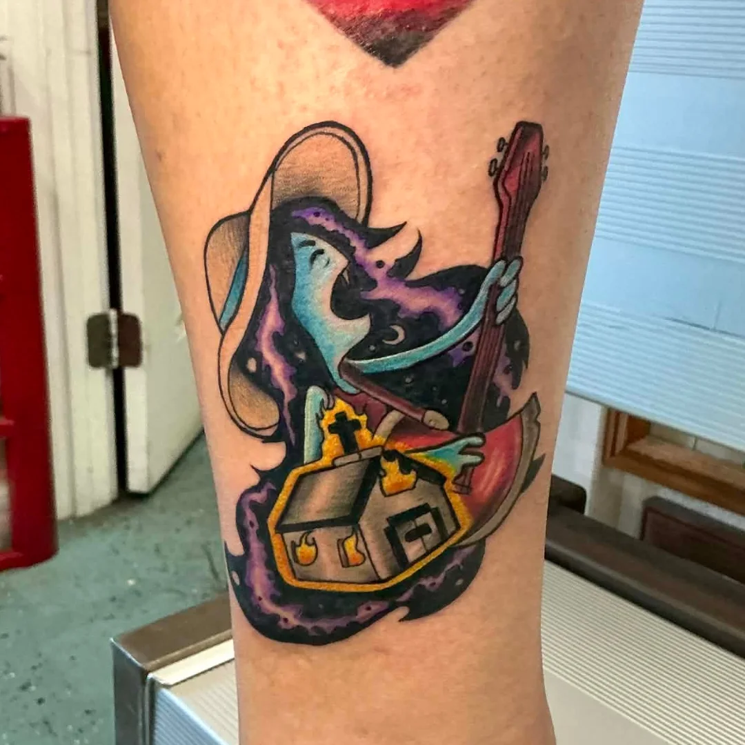 Ghostly figure playing guitar American traditional tattoo on the forearm by Rando Rad