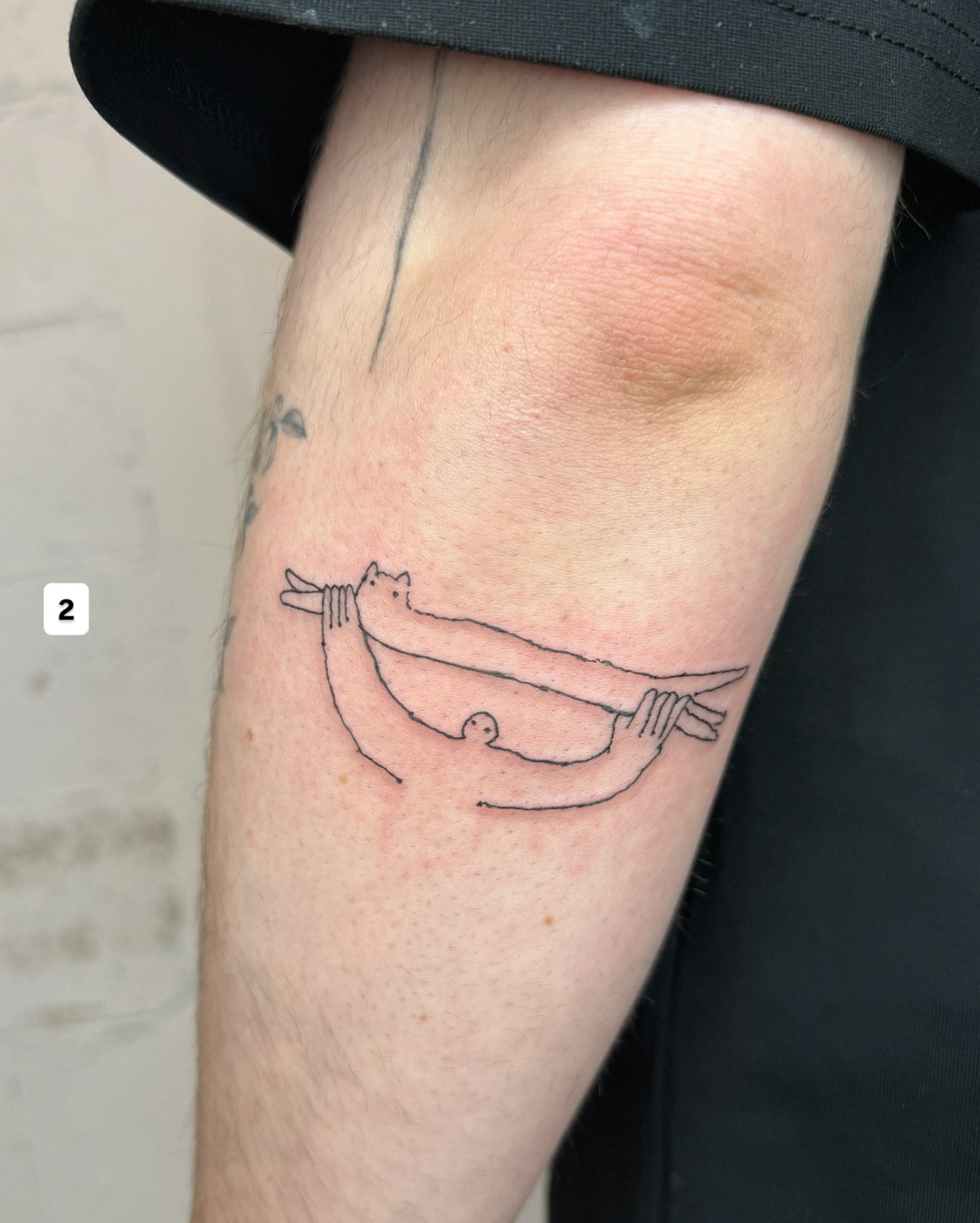 Hammock minimalist tattoo on the forearm by Eden Kalif