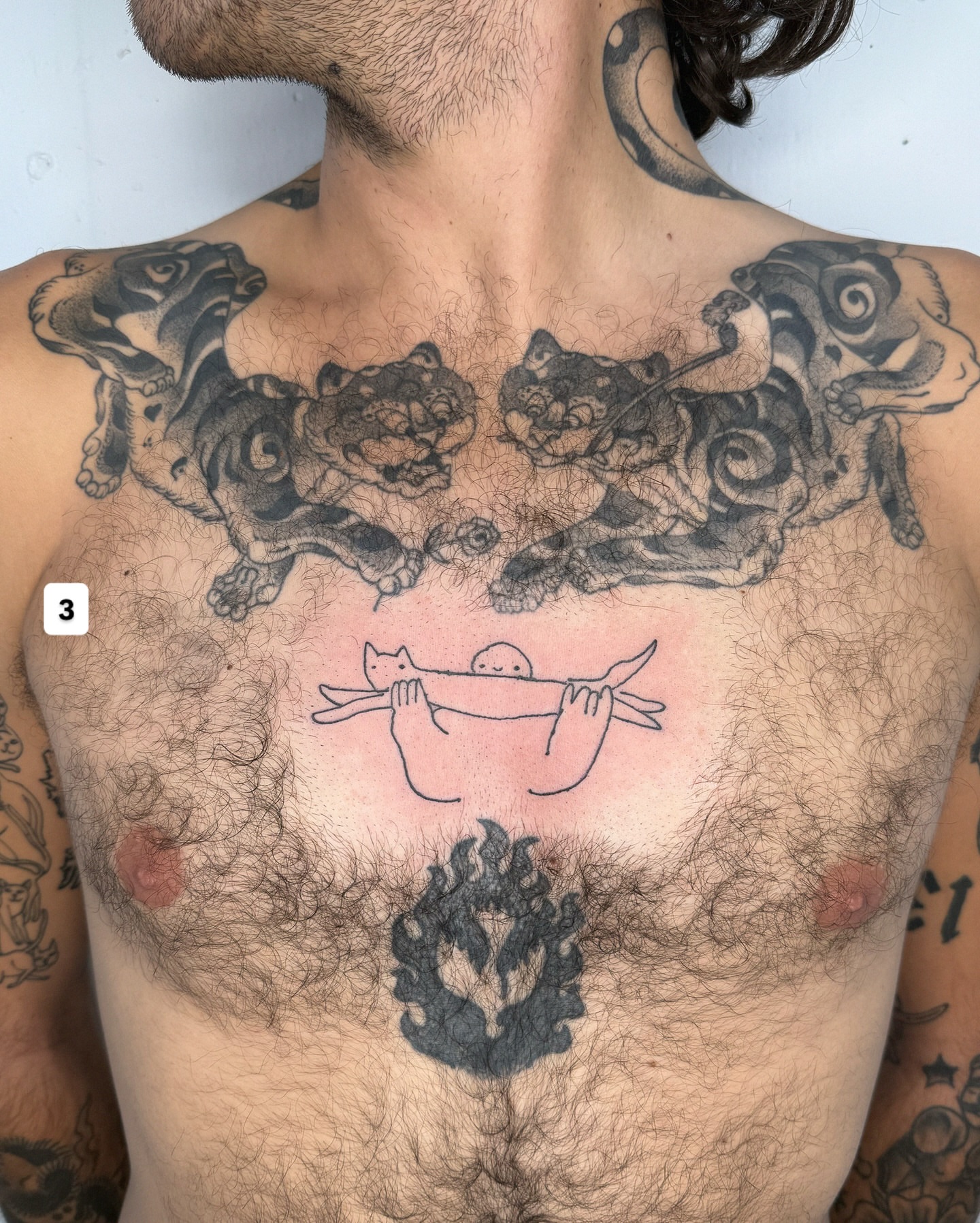 Dogs and cat black and grey tattoo on the chest by Eden Kalif