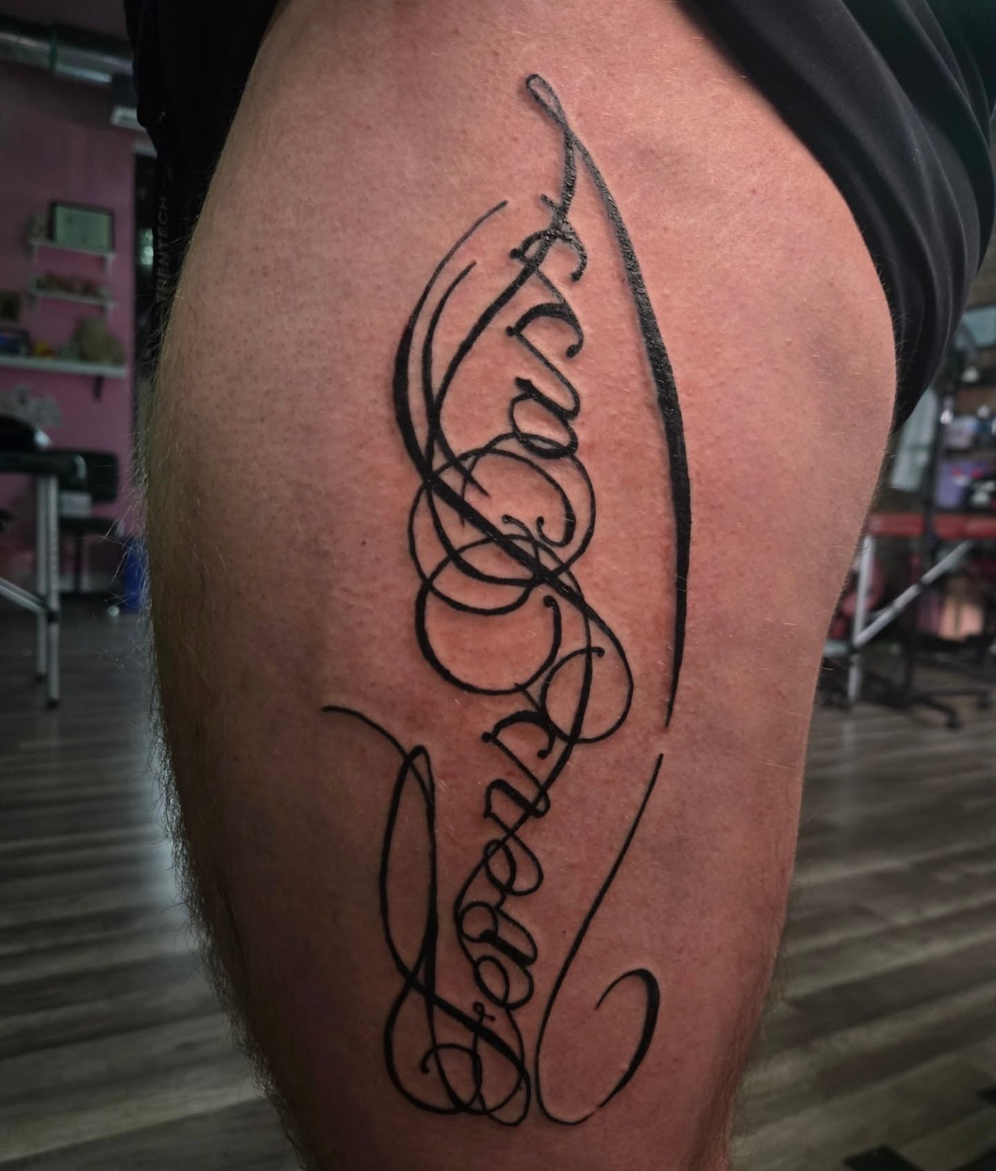 Script lettering lettering script tattoo on the thigh by Lane