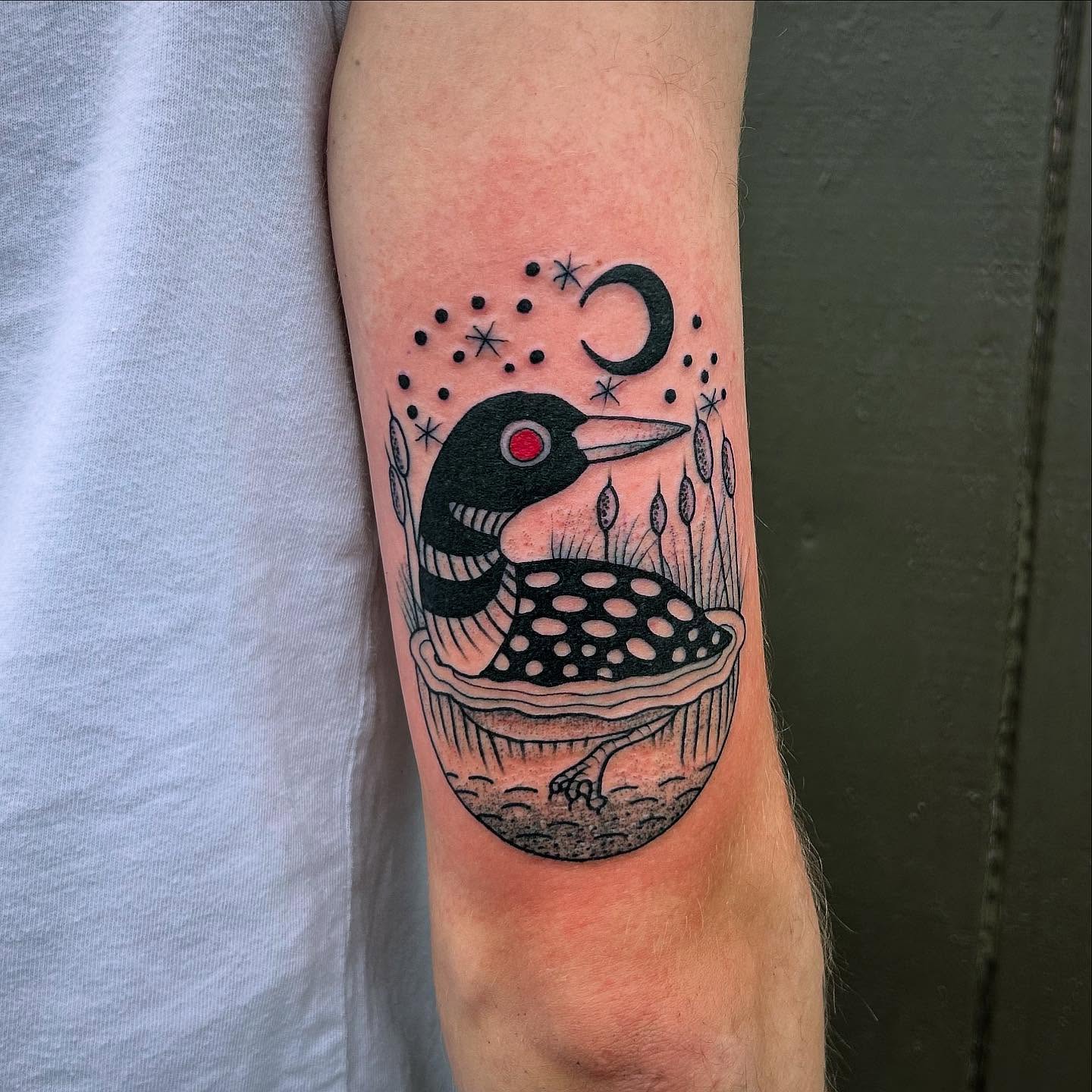 Loon dotwork tattoo on the forearm by Erica Finley