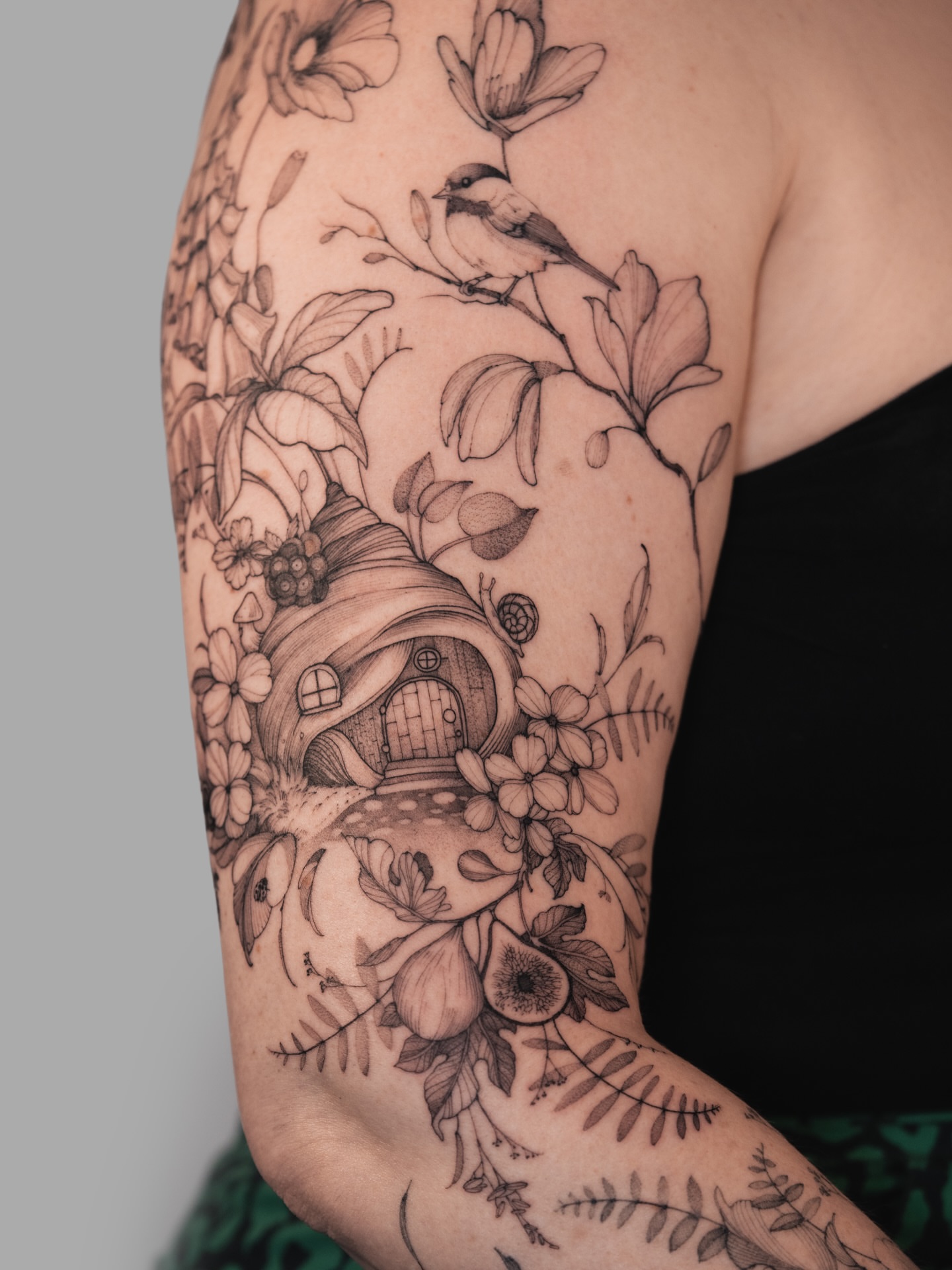 Gnome house with flowers realism tattoo on the forearm by Yuliia Babych tattoo AUSTIN