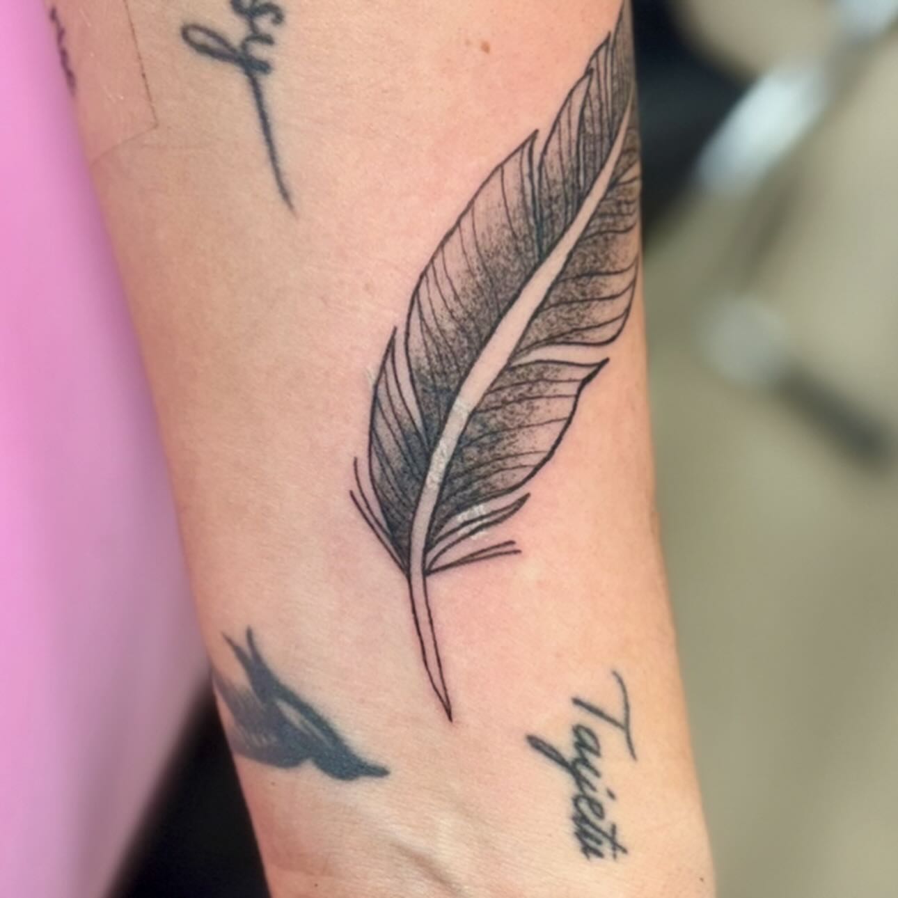 Feather dotwork tattoo on the forearm by bradyn thornton: eco-tattoo artist