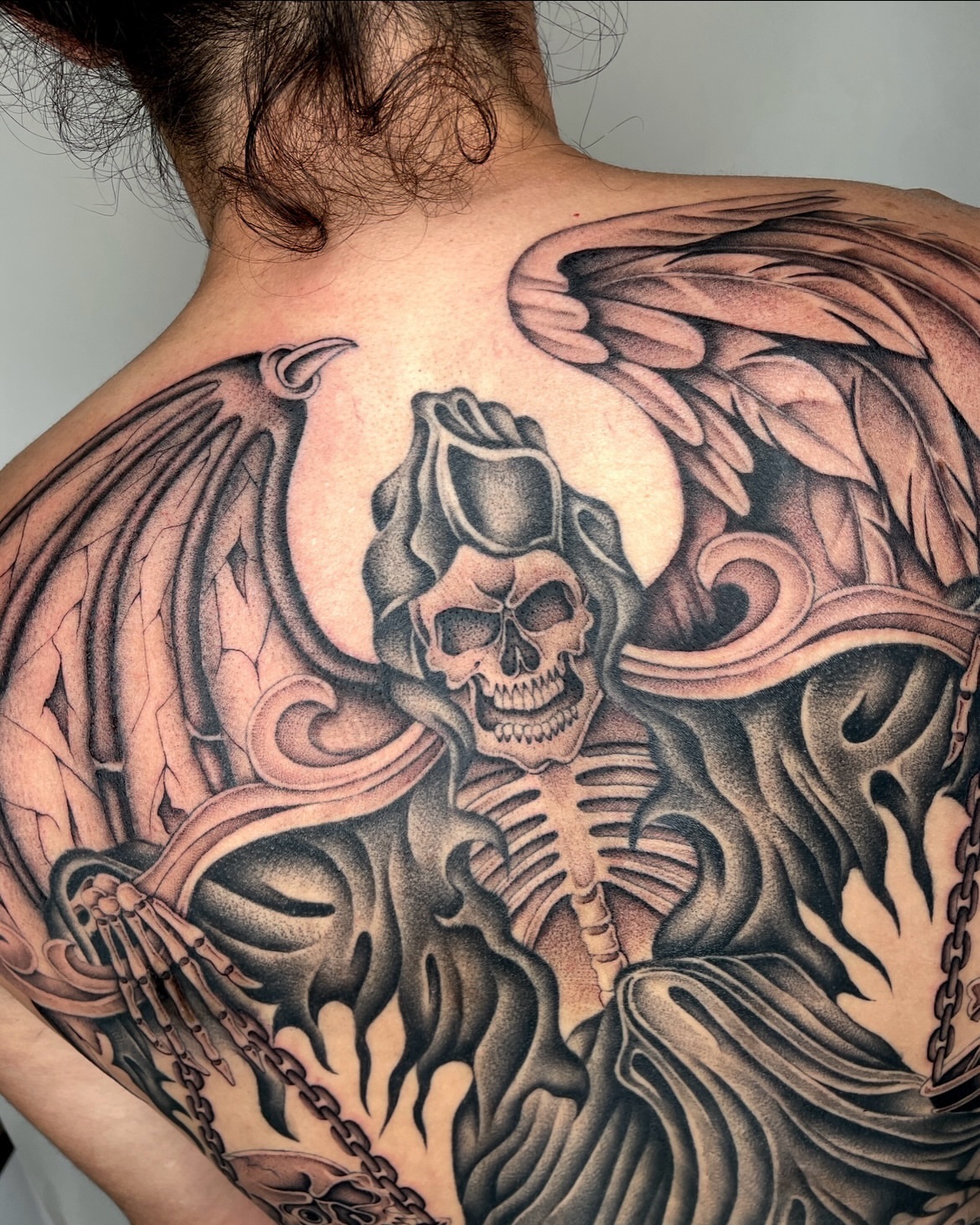 Skeleton with wings dotwork tattoo on the back by IVY