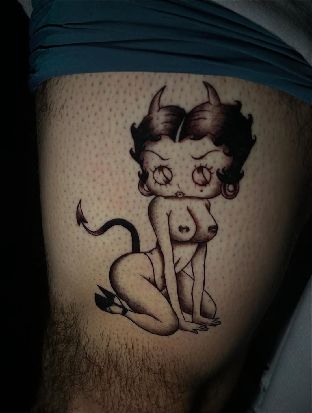 Betty Boop as a devil neo-traditional tattoo on the thigh by ꧁༺𝔅𝔦𝔤 ℭ𝔥𝔲𝔫𝔤𝔲𝔷༻꧂, San Diego, California