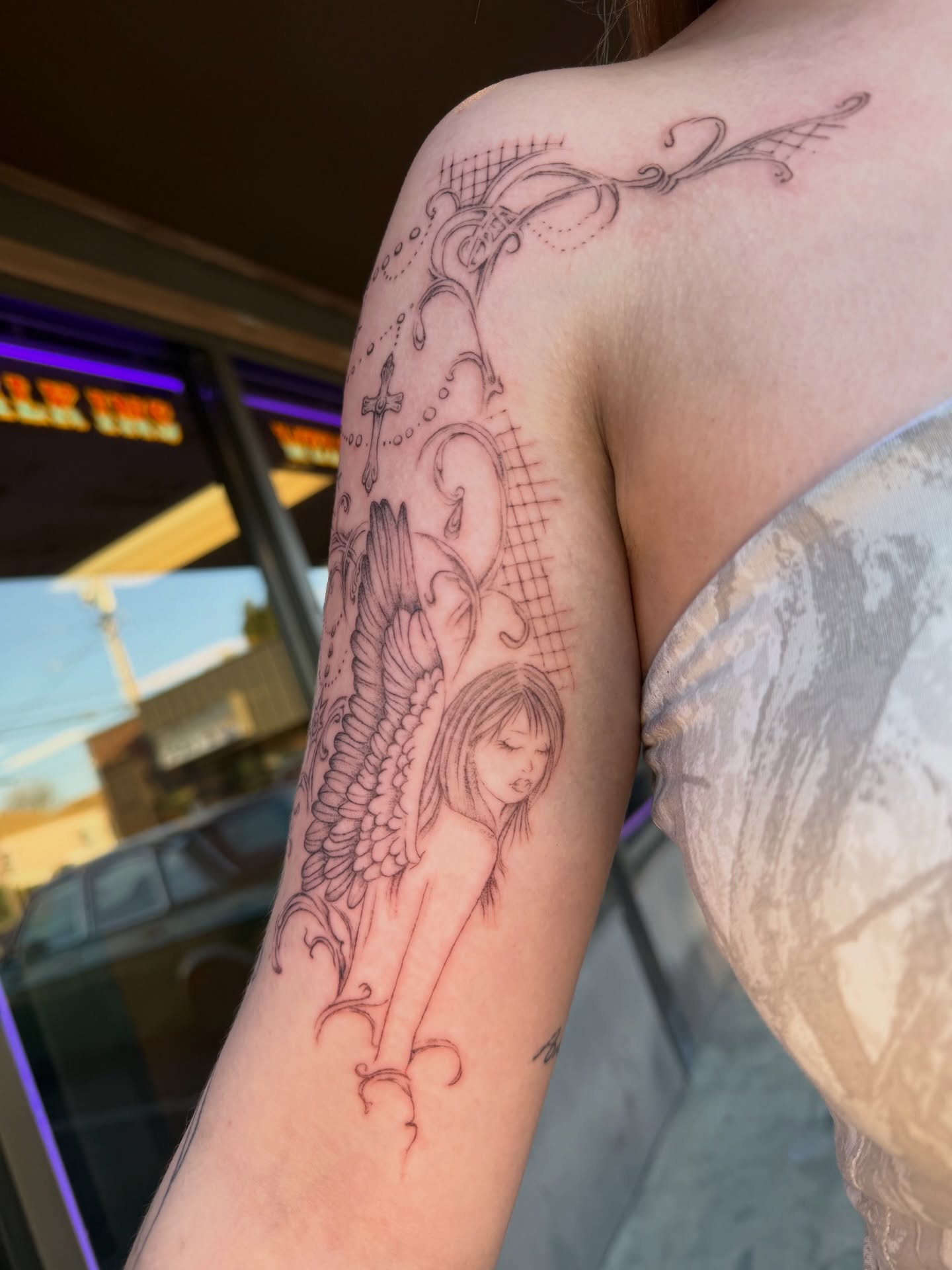 Angel black and grey tattoo on the forearm by Maddie Blosser, Portland, Oregon
