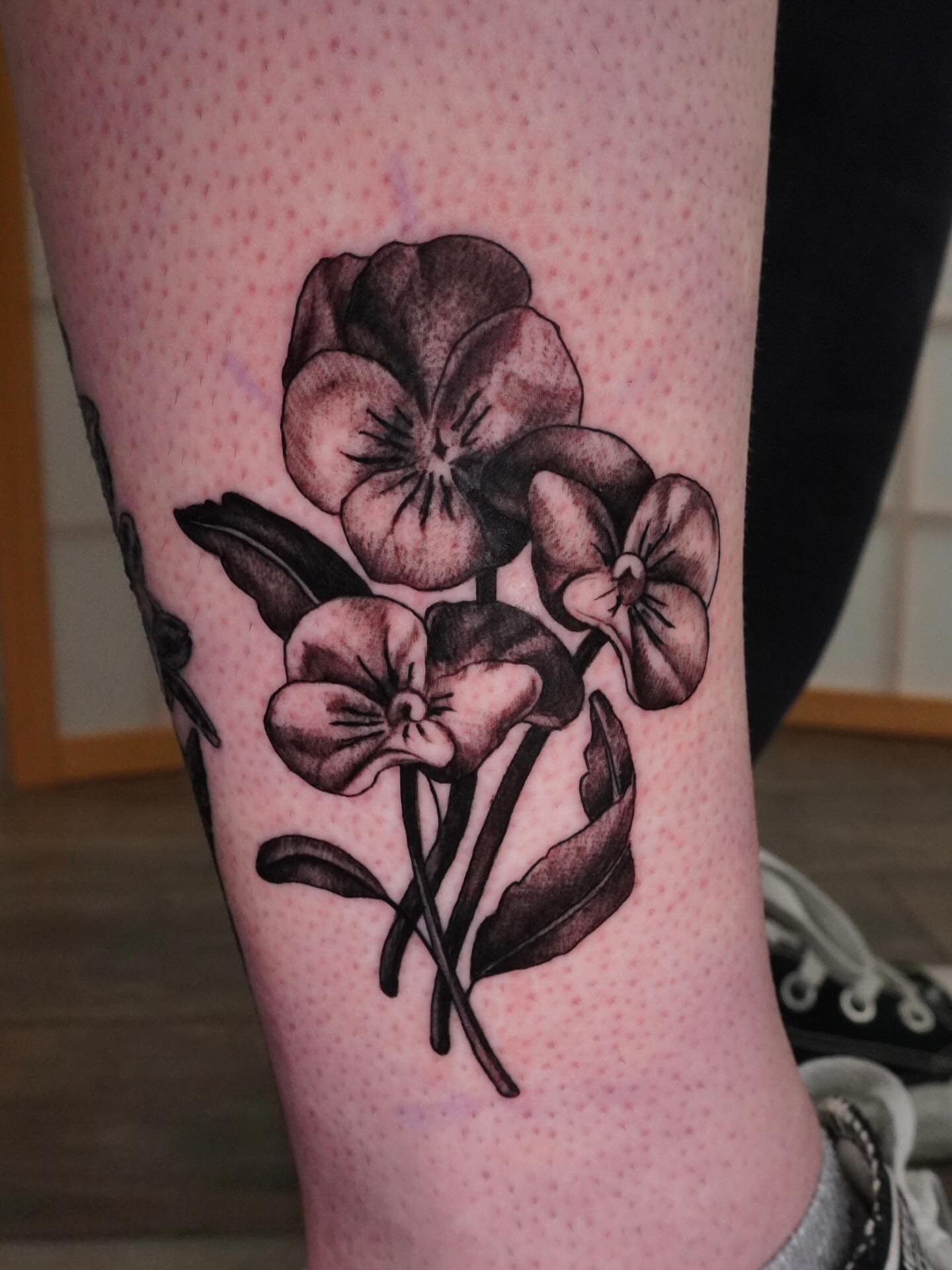 Pansies black and grey tattoo on the forearm by hallow ☣︎ tattoo artist, Philadelphia, Pennsylvania
