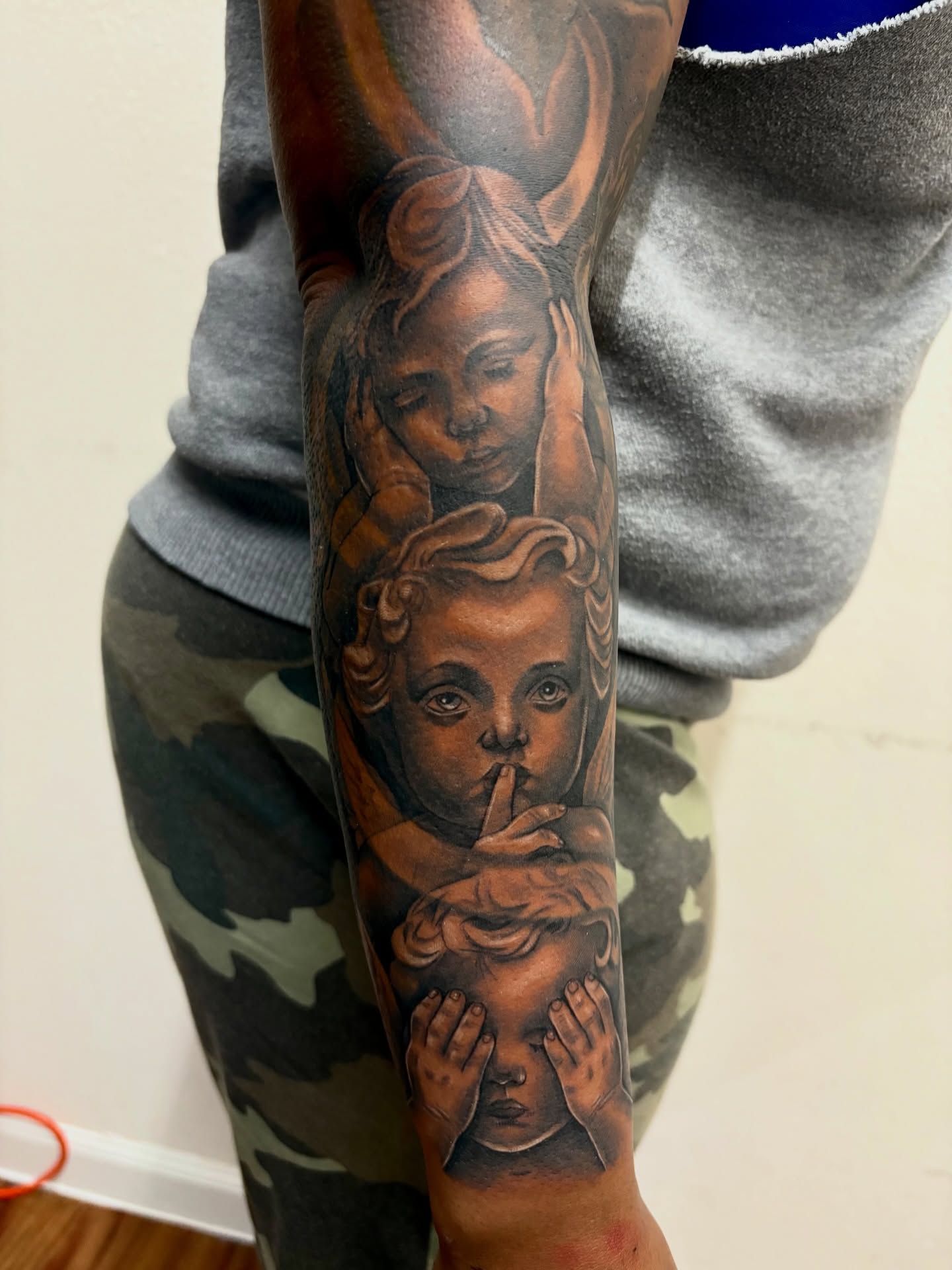 Angels realism tattoo on the forearm by Kevin Palma